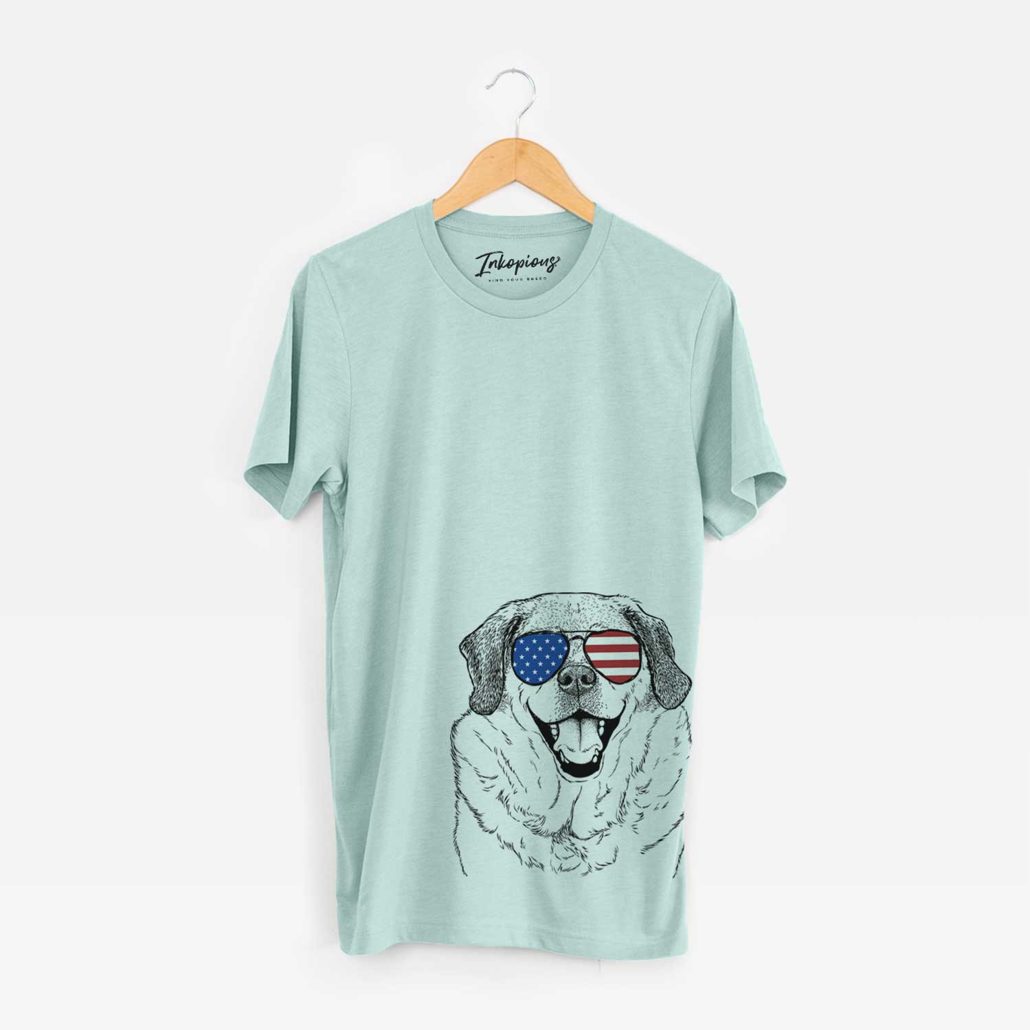 Hand-drawn sketch of Little Man the Puggle wearing American flag sunglasses on a Heather Sage Unisex crewneck