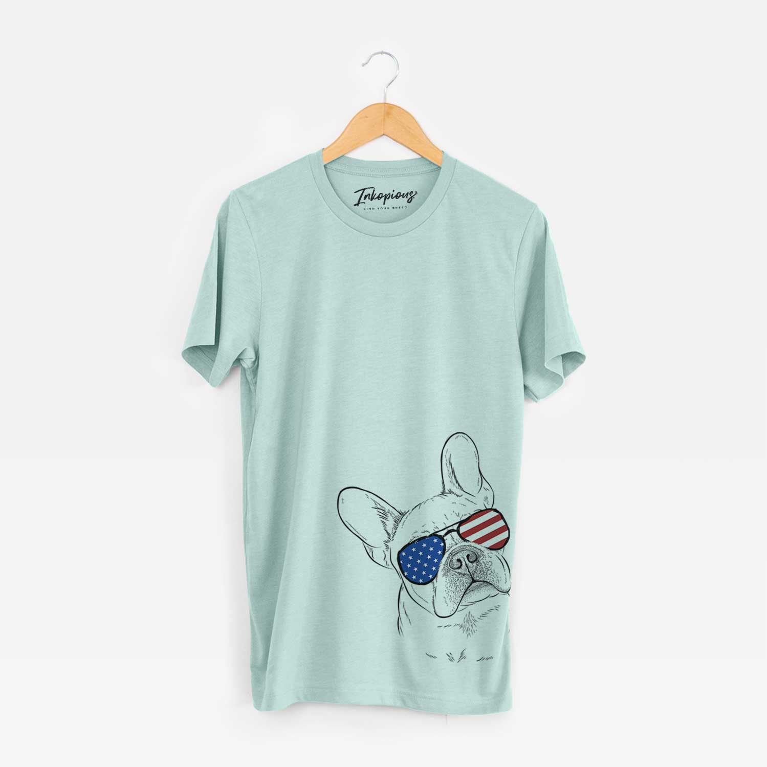 Hand-drawn sketch of Loki the French Bulldog wearing American flag sunglasses on a Heather Sage Unisex crewneck