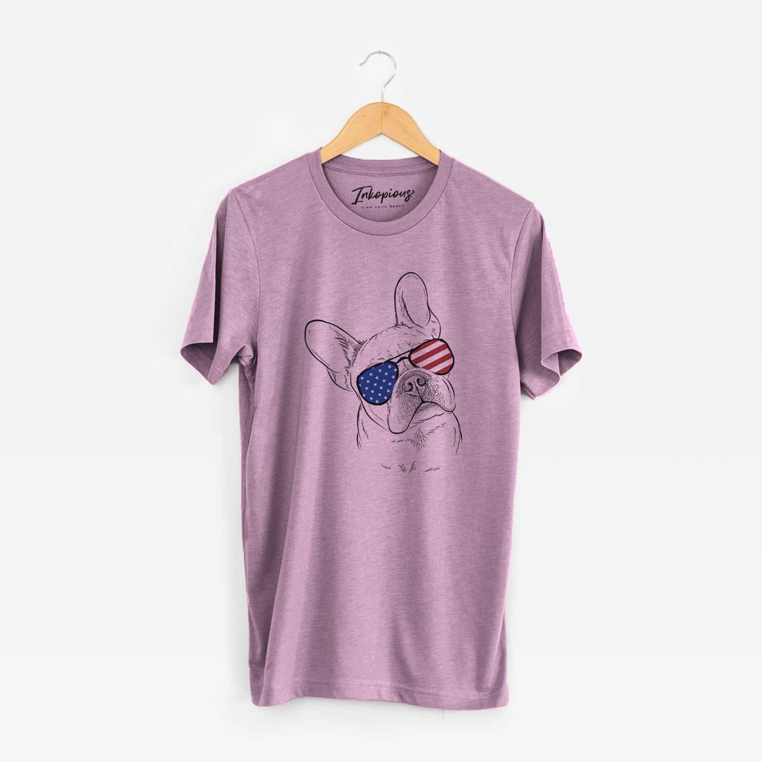 Hand-drawn sketch of Loki the French Bulldog wearing American flag sunglasses on an Orchid Unisex crewneck