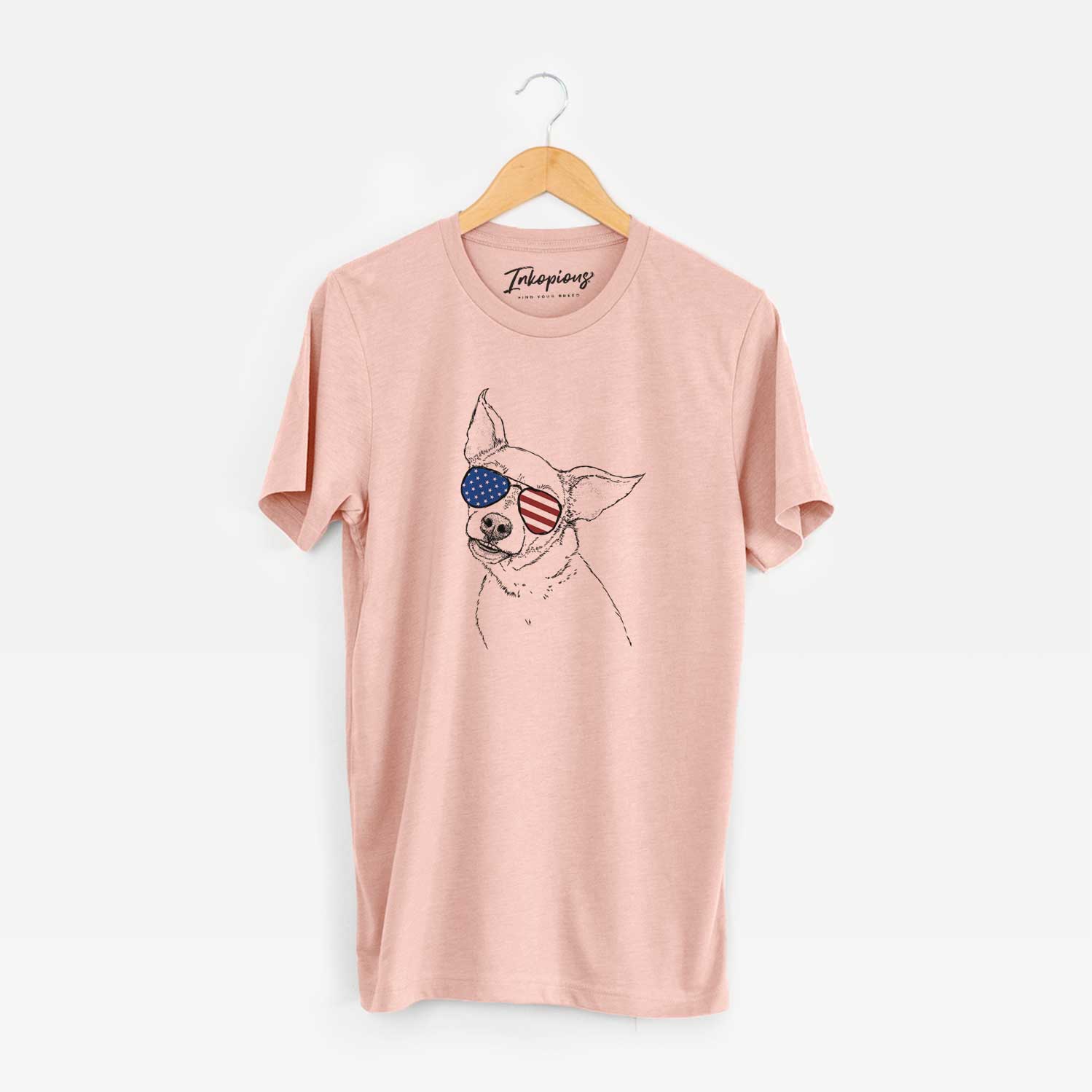 Hand-drawn sketch of Lola the Chiweenie wearing American flag sunglasses on a Peach Unisex crewneck