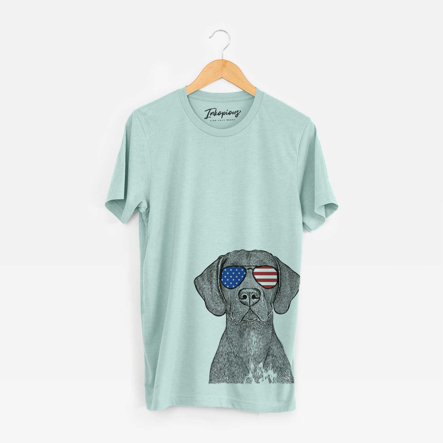 Hand-drawn sketch of Lucifer the German Shorthaired Pointer wearing American flag sunglasses on a Heather Sage Unisex crewneck