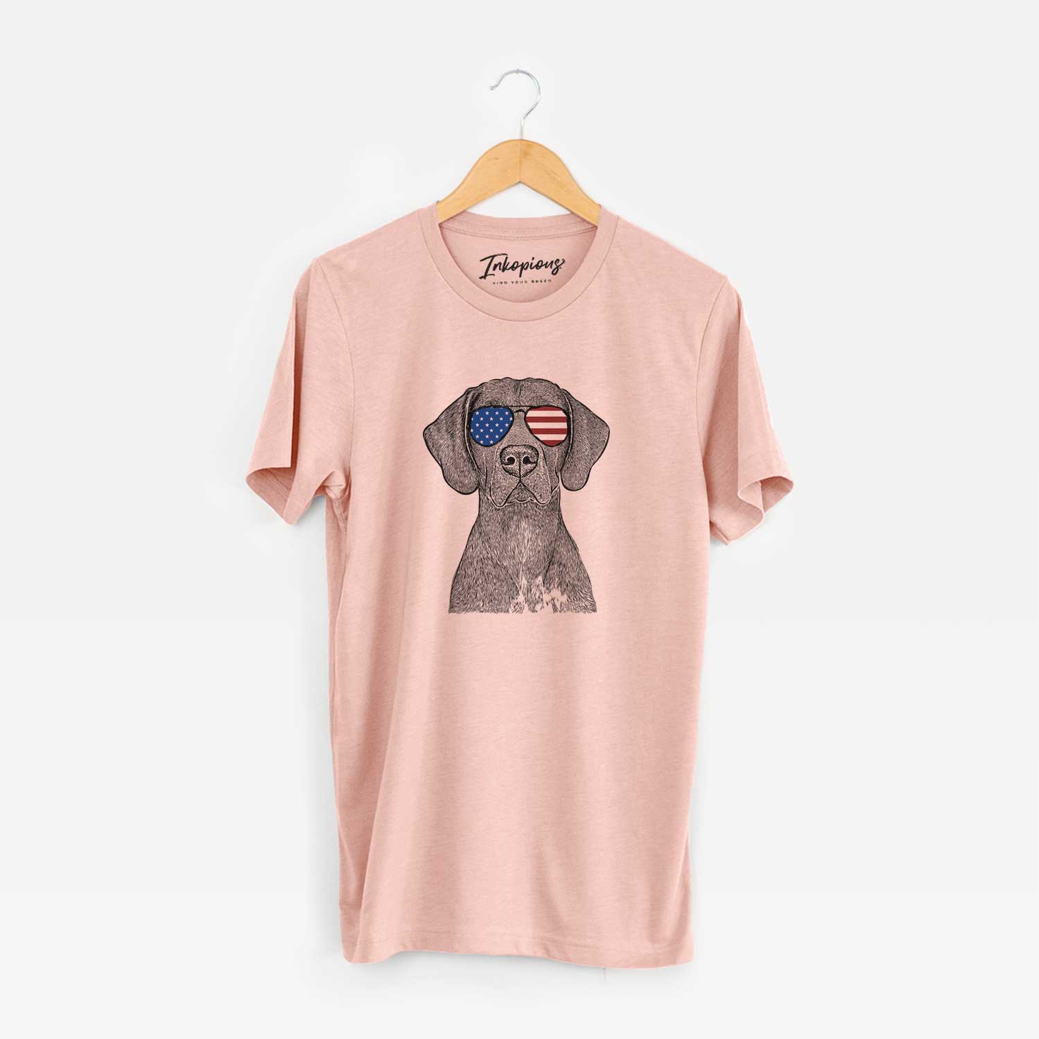 Hand-drawn sketch of Lucifer the German Shorthaired Pointer wearing American flag sunglasses on a Peach Unisex crewneck