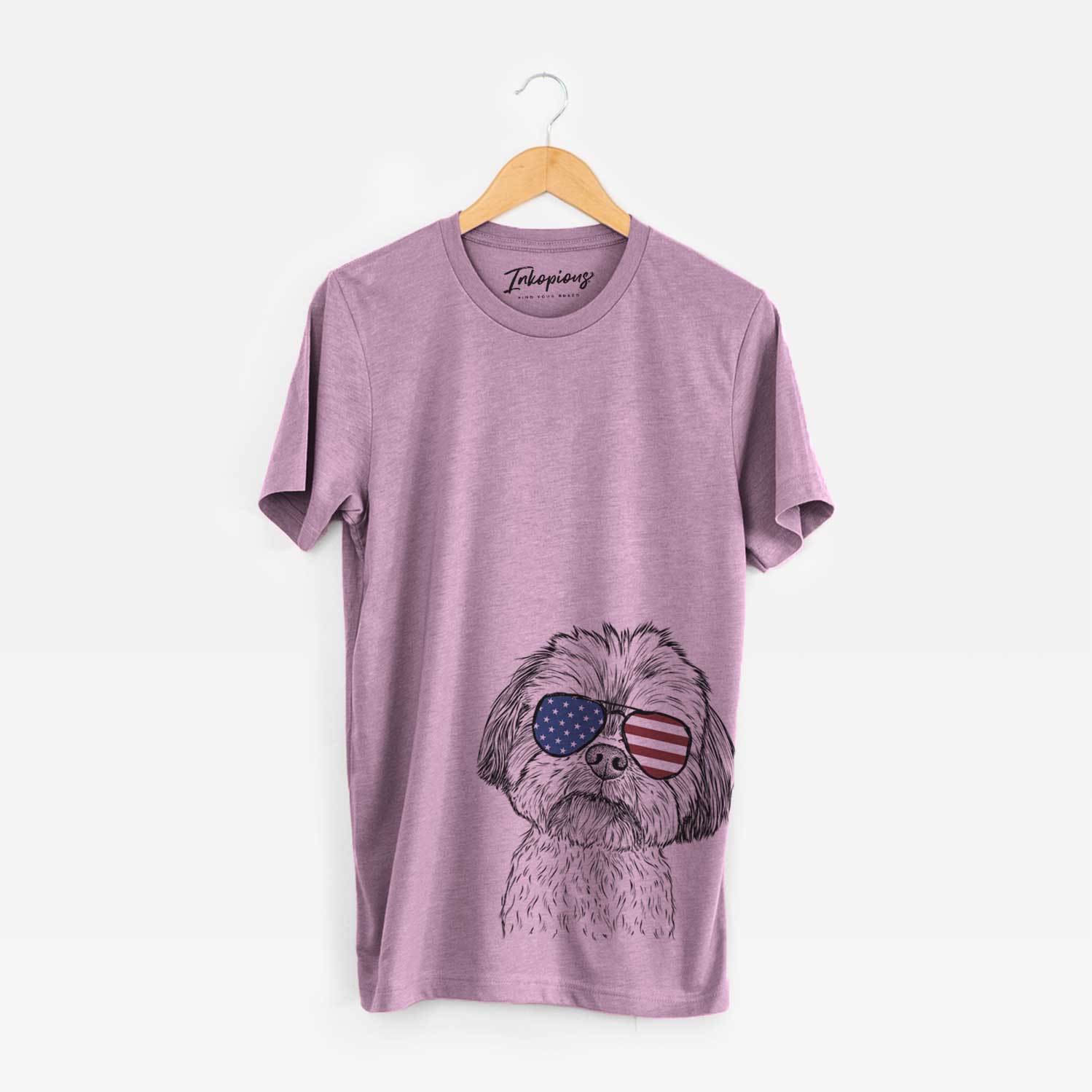 Hand-drawn sketch of Lucy the Shorkie wearing American flag sunglasses on an Orchid Unisex crewneck