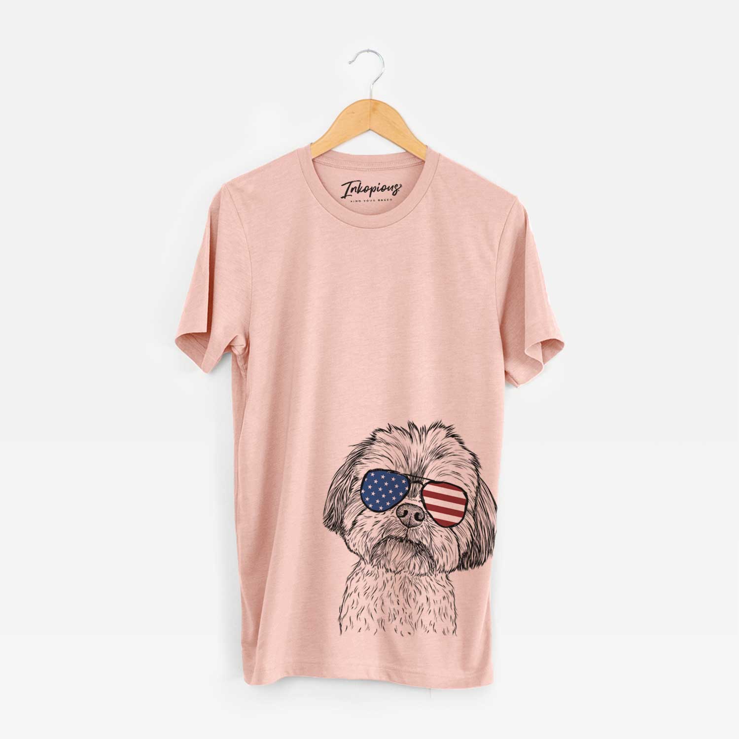 Hand-drawn sketch of Lucy the Shorkie wearing American flag sunglasses on a Peach Unisex crewneck