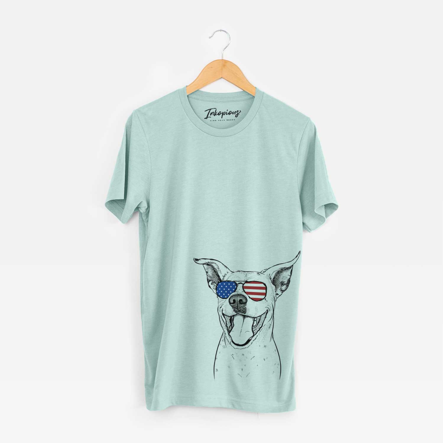 Hand-drawn sketch of Maddie the Dalmatian Pitbull Mix wearing American flag sunglasses on a Heather Sage Unisex crewneck