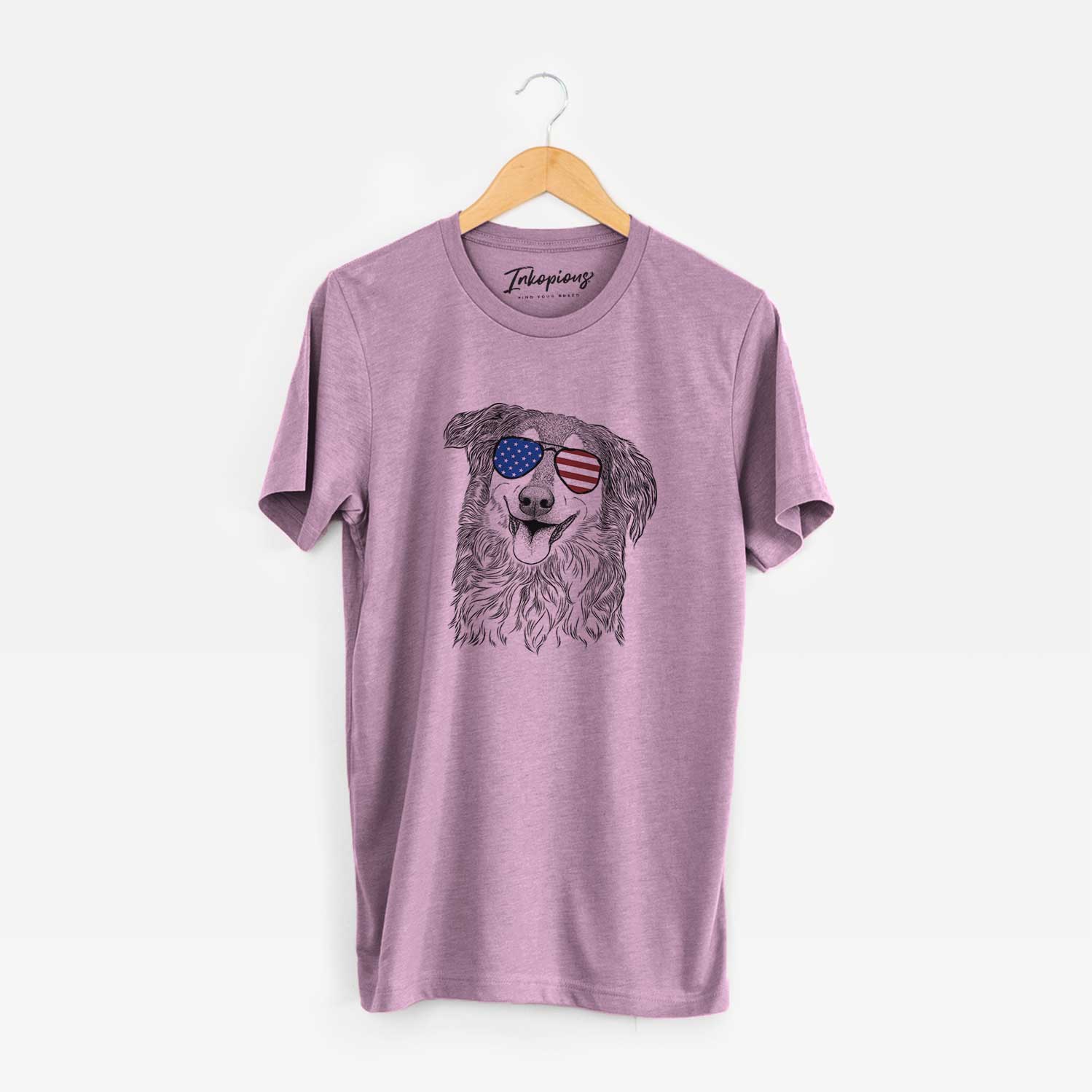 Hand-drawn sketch of Maddie the English Shepherd wearing American flag sunglasses on an Orchid Unisex crewneck