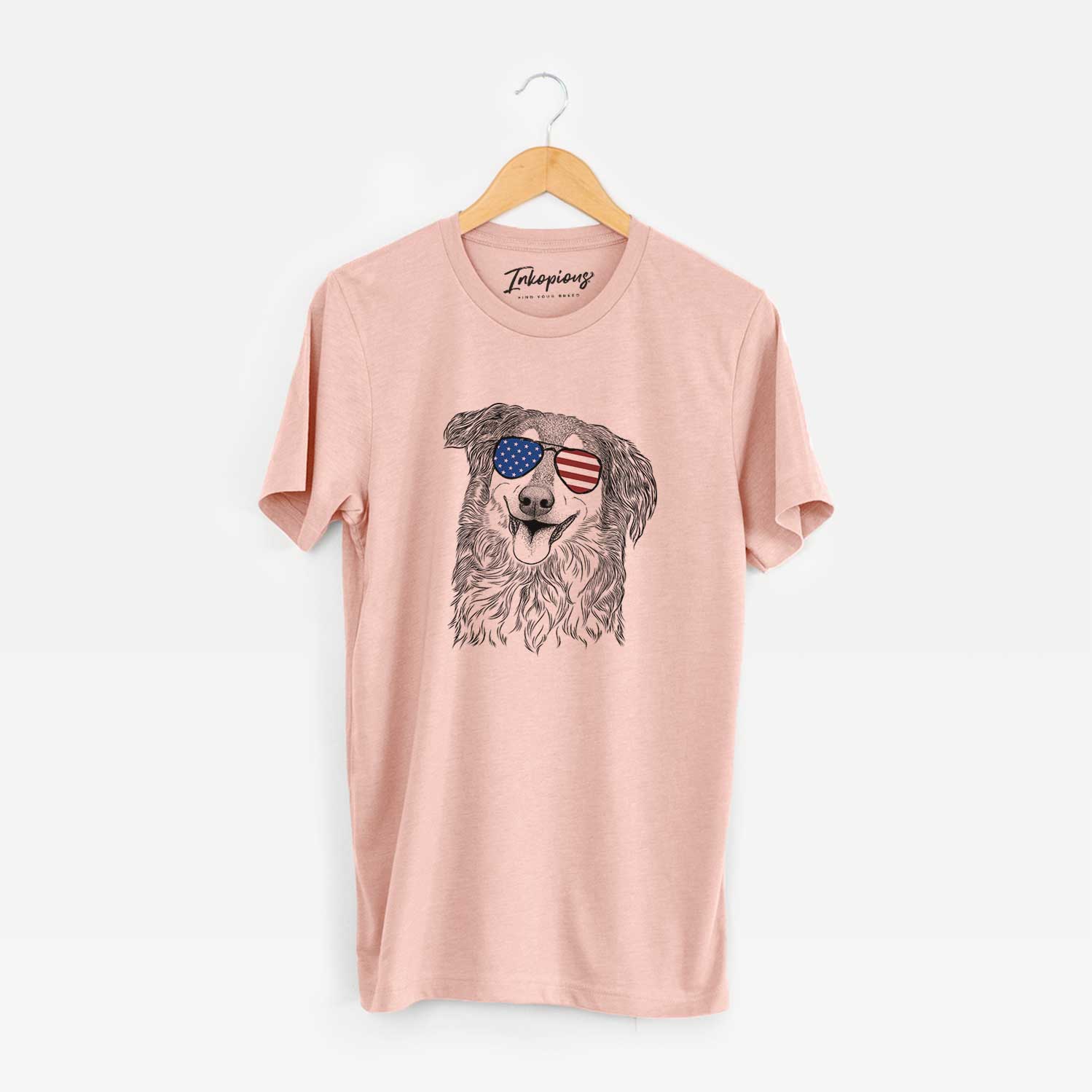 Hand-drawn sketch of Maddie the English Shepherd wearing American flag sunglasses on a Peach Unisex crewneck