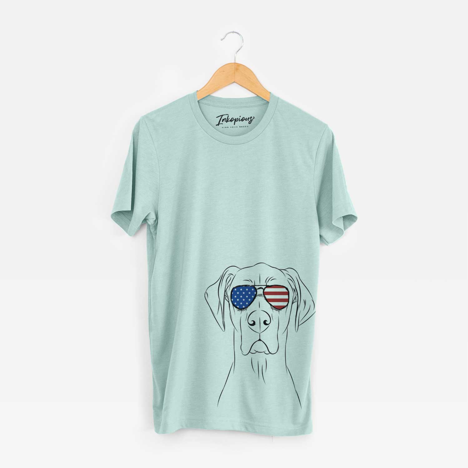 Hand-drawn sketch of Maddox the Great Dane wearing American flag sunglasses on a Heather Sage Unisex crewneck
