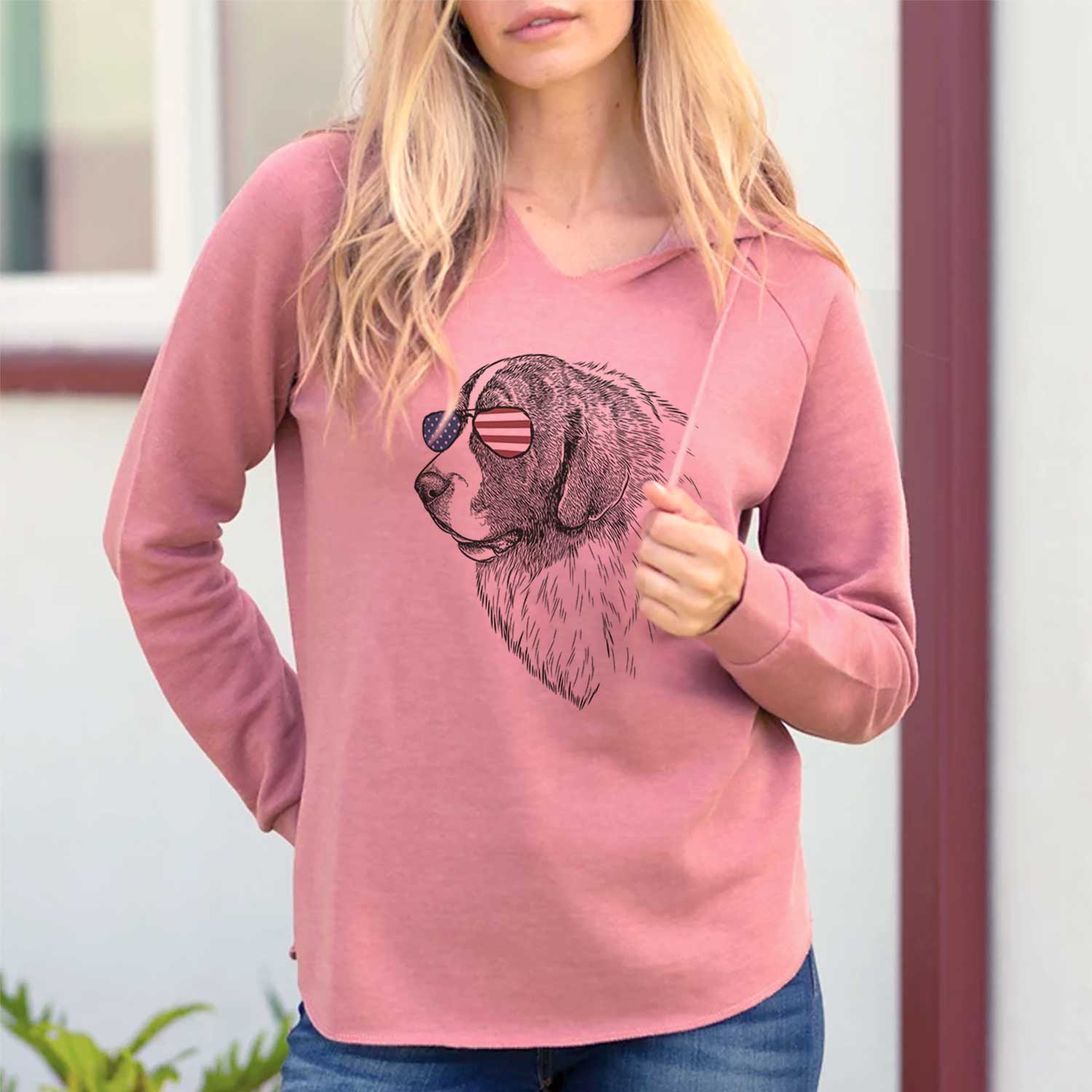 Hand-drawn sketch of Magnus the Pyrenean Mastiff wearing American flag sunglasses on a Dusty Rose Cali Wave Hooded Sweatshirt, lifestyle photo