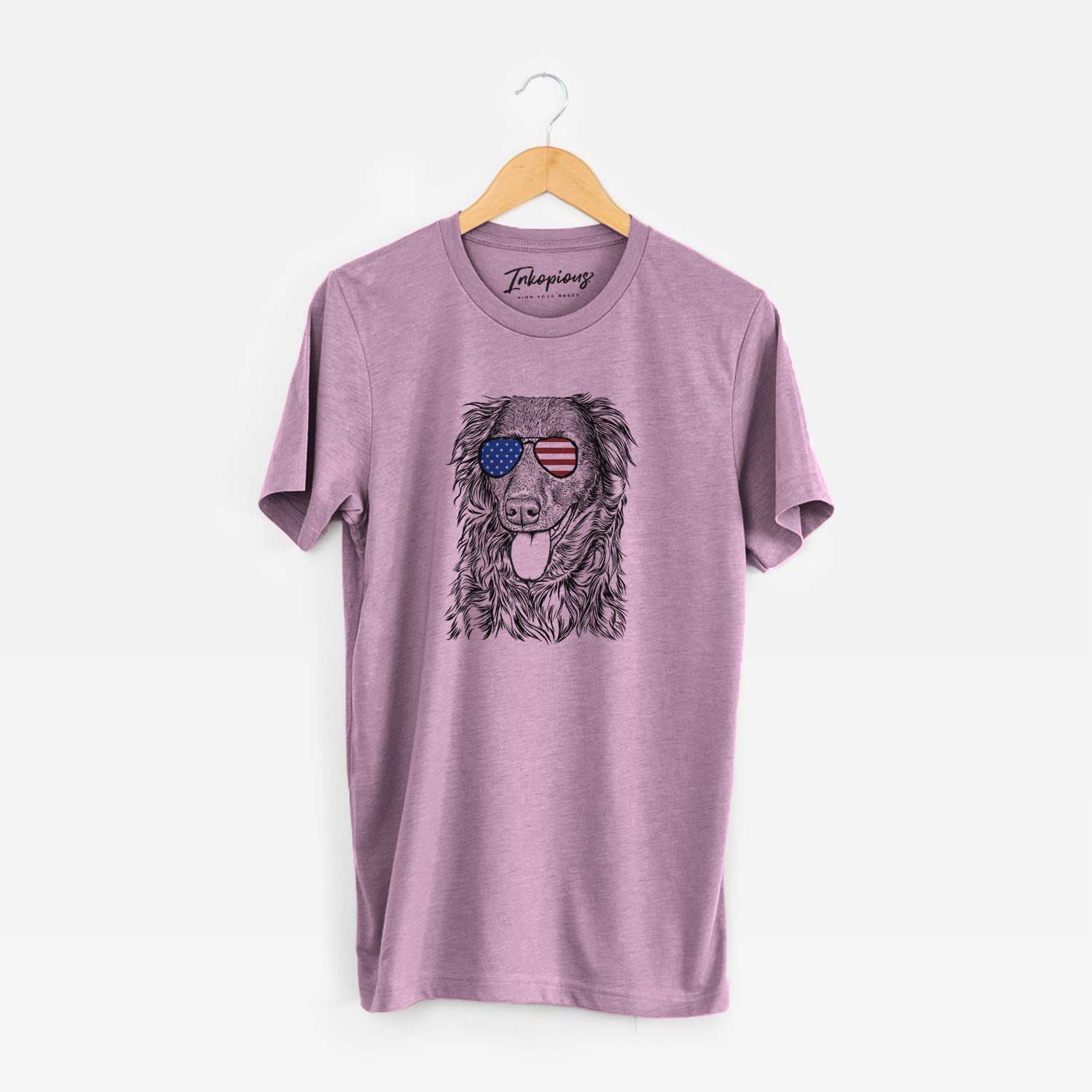 Hand-drawn sketch of Maisie Mae the Aussiedor wearing American flag sunglasses on an Orchid Unisex crewneck