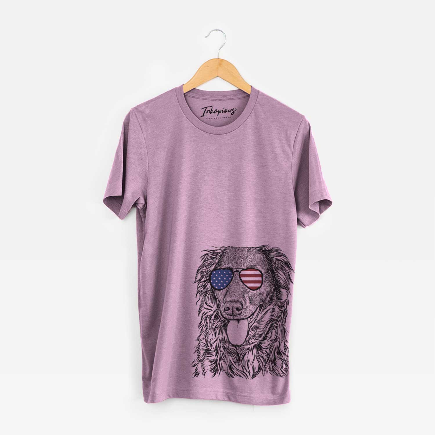 Hand-drawn sketch of Maisie Mae the Aussiedor wearing American flag sunglasses on an Orchid Unisex crewneck