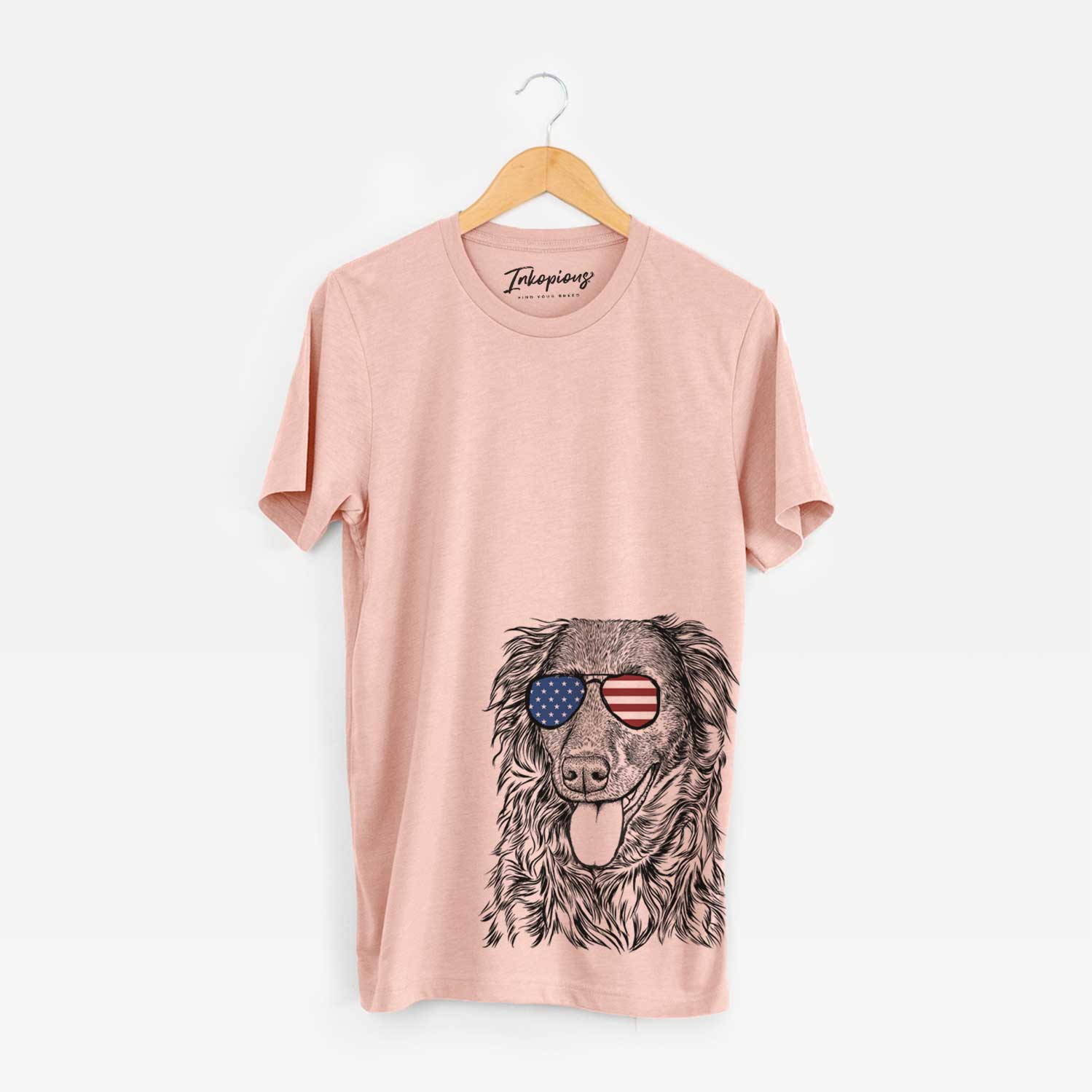 Hand-drawn sketch of Maisie Mae the Aussiedor wearing American flag sunglasses on a Peach Unisex crewneck