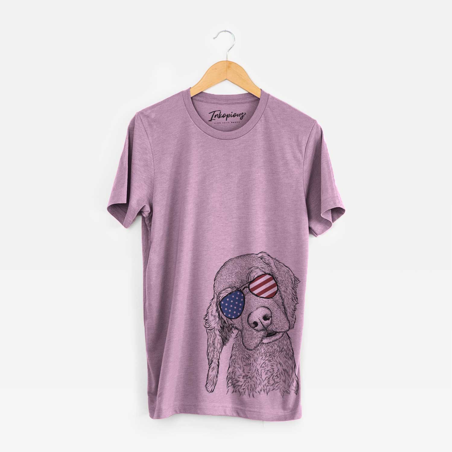 Hand-drawn sketch of Mambo #5 the Cocker Spaniel wearing American flag sunglasses on an Orchid Unisex crewneck