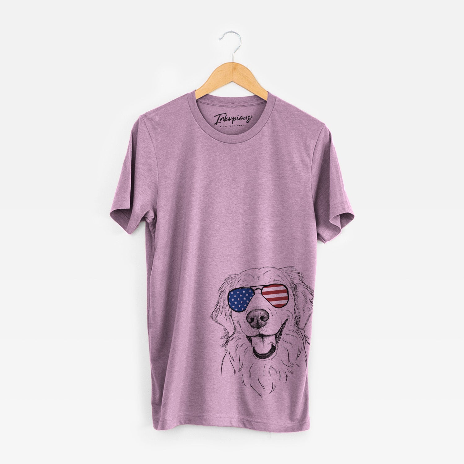 Hand-drawn sketch of Maple the Golden Retriever wearing American flag sunglasses on an Orchid Unisex crewneck