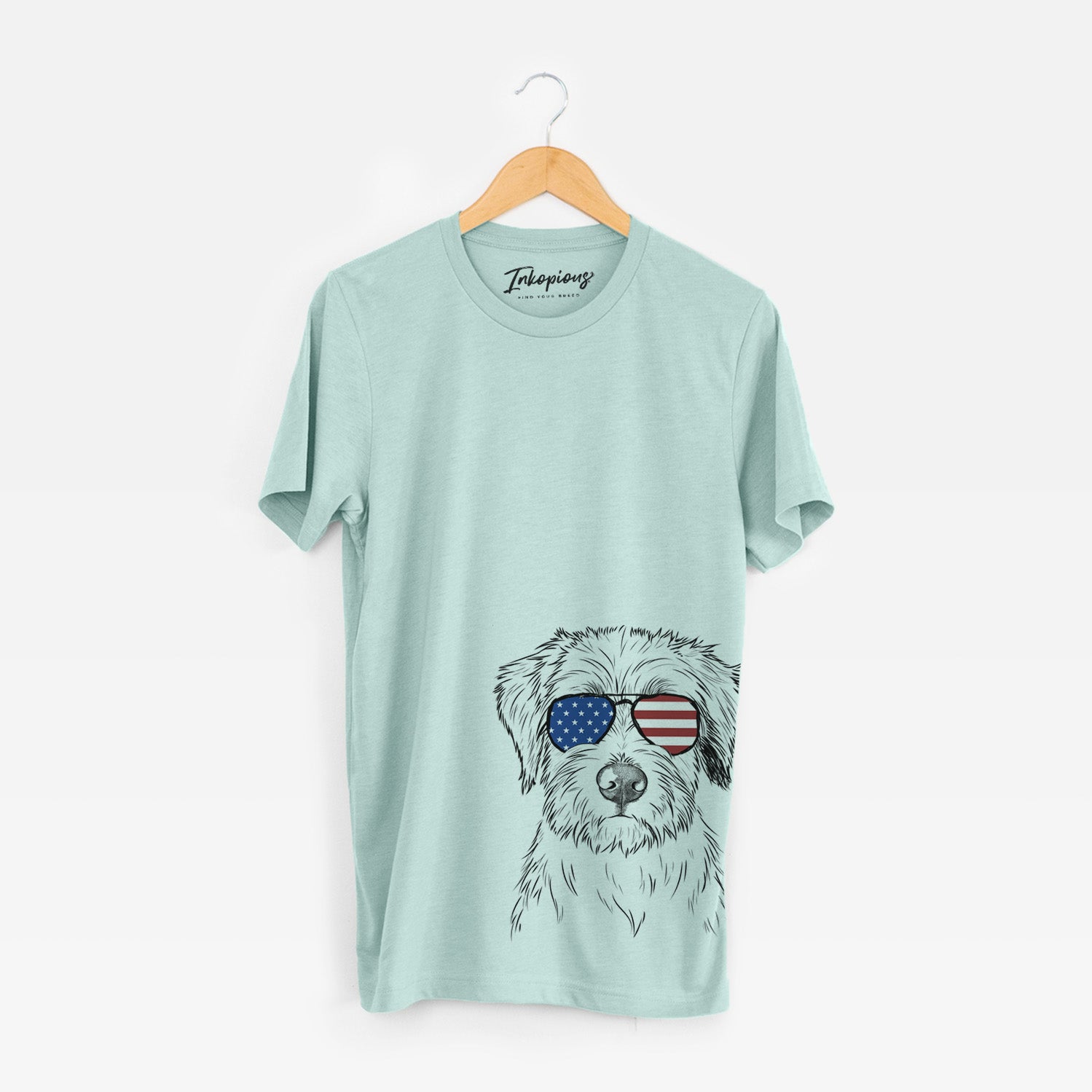 Hand-drawn sketch of Marek the Bernedoodle wearing American flag sunglasses on a Heather Sage Unisex crewneck