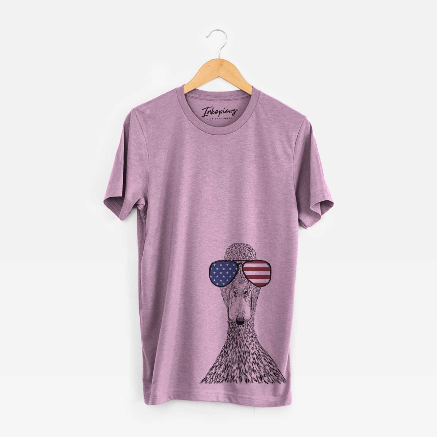 Hand-drawn sketch of Marge the Mallard Duck wearing American flag sunglasses on an Orchid Unisex crewneck