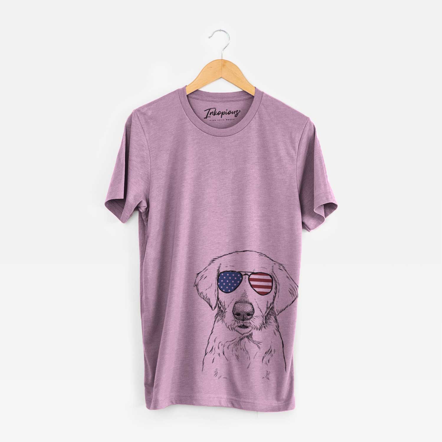 Hand-drawn sketch of Marley Sue the Labradoodle wearing American flag sunglasses on an Orchid Unisex crewneck