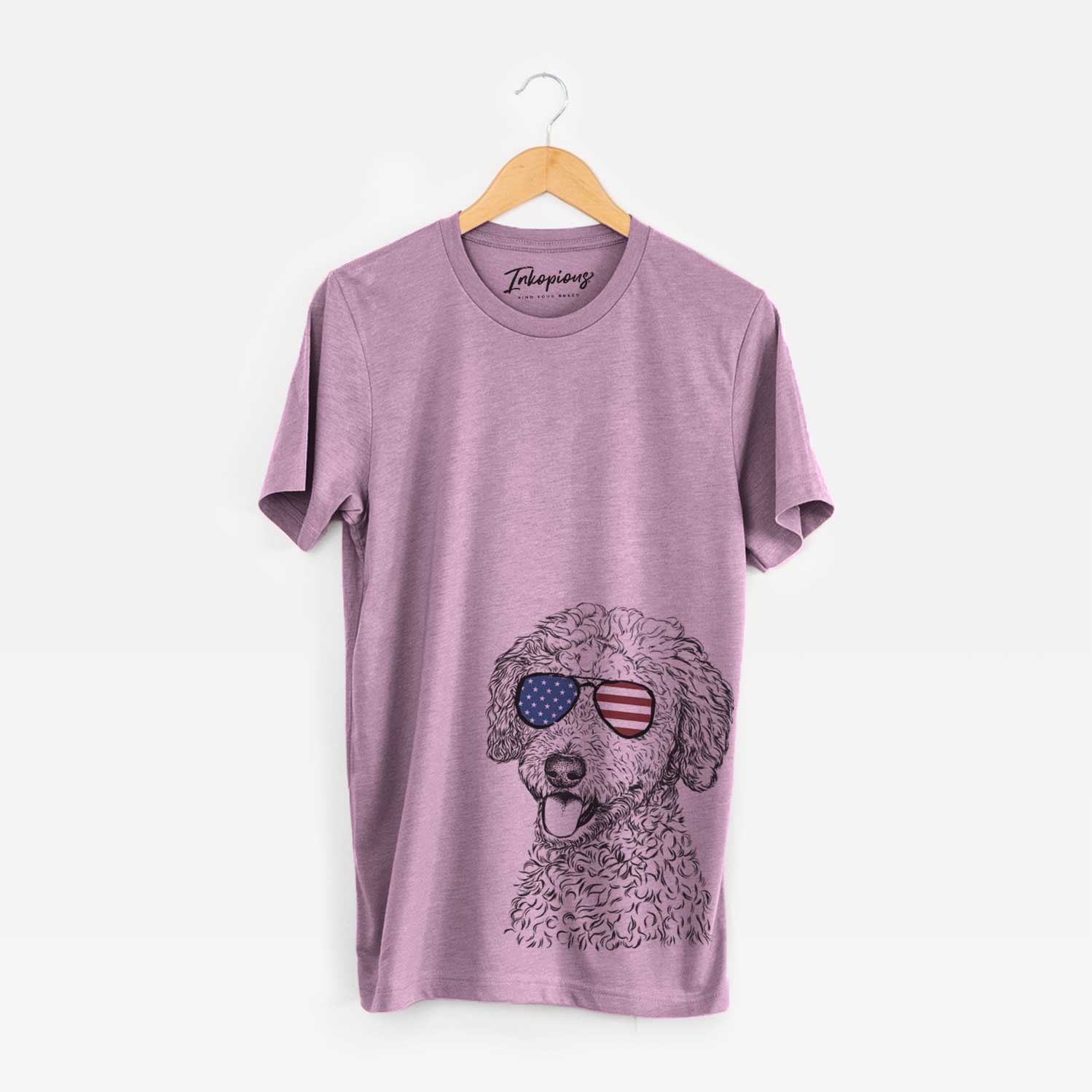 Hand-drawn sketch of Marlow the Goldendoodle wearing American flag sunglasses on an Orchid Unisex crewneck