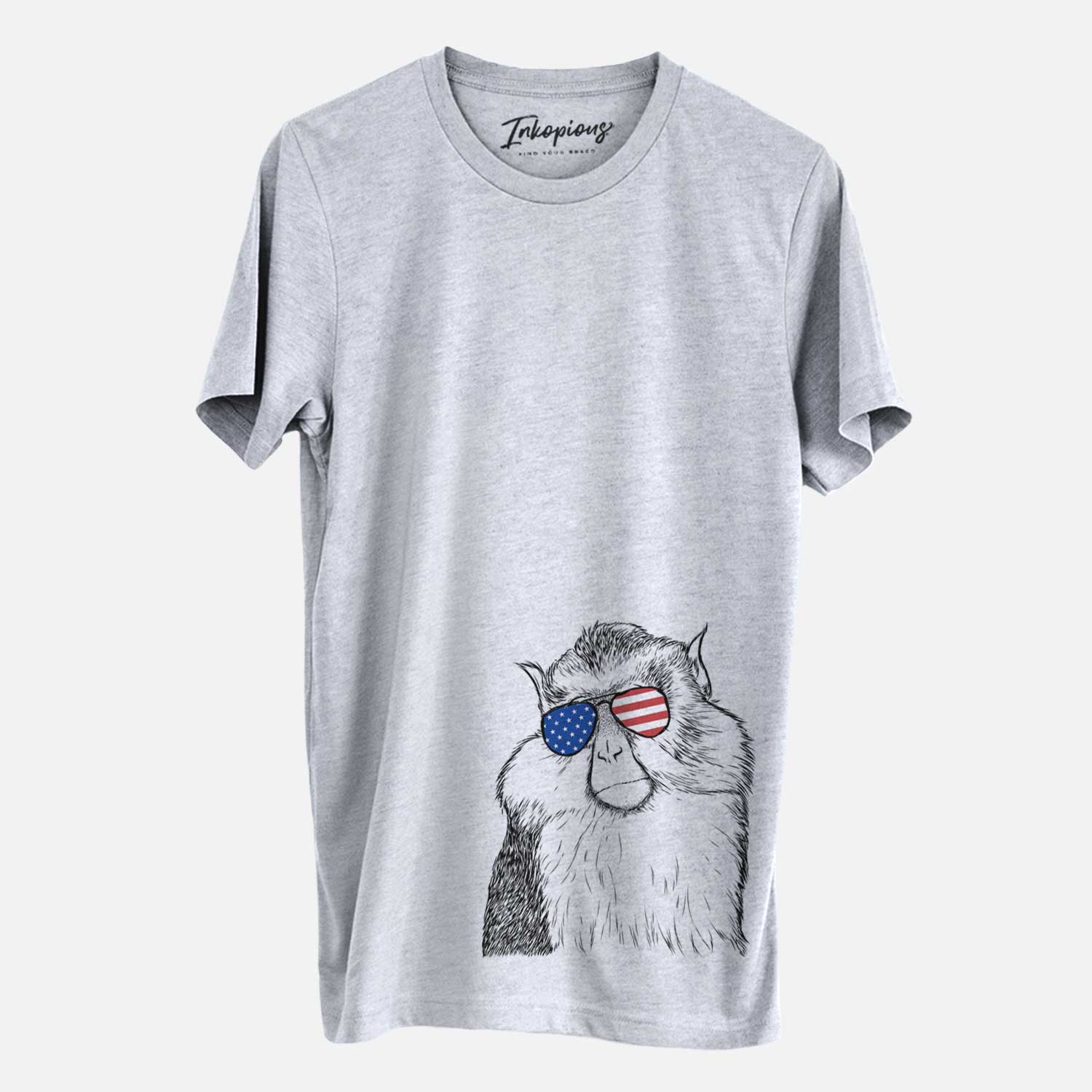 Hand-drawn sketch of Matata the Mona Monkey wearing American flag sunglasses on a Grey Unisex crewneck