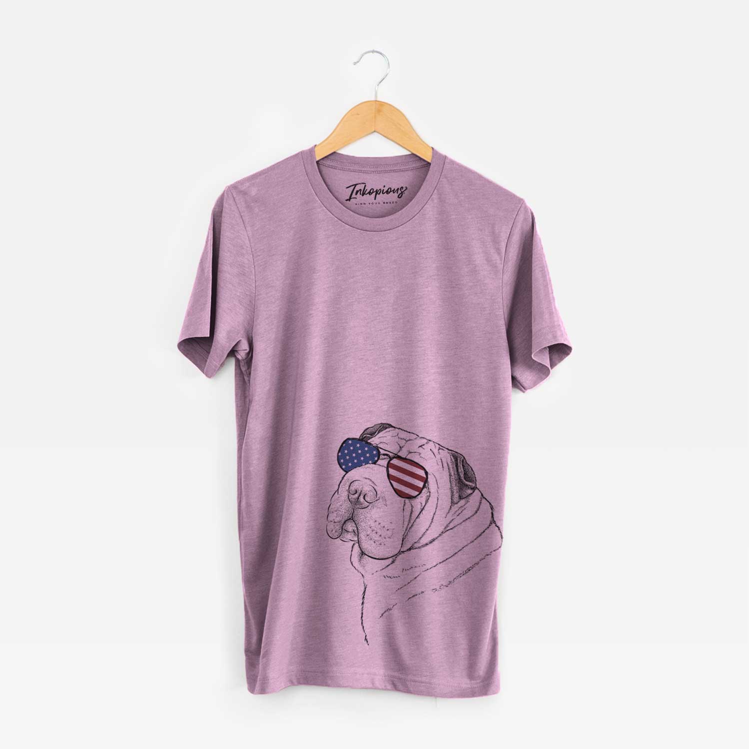 Hand-drawn sketch of Maximus the Shar Pei wearing American flag sunglasses on an Orchid Unisex crewneck