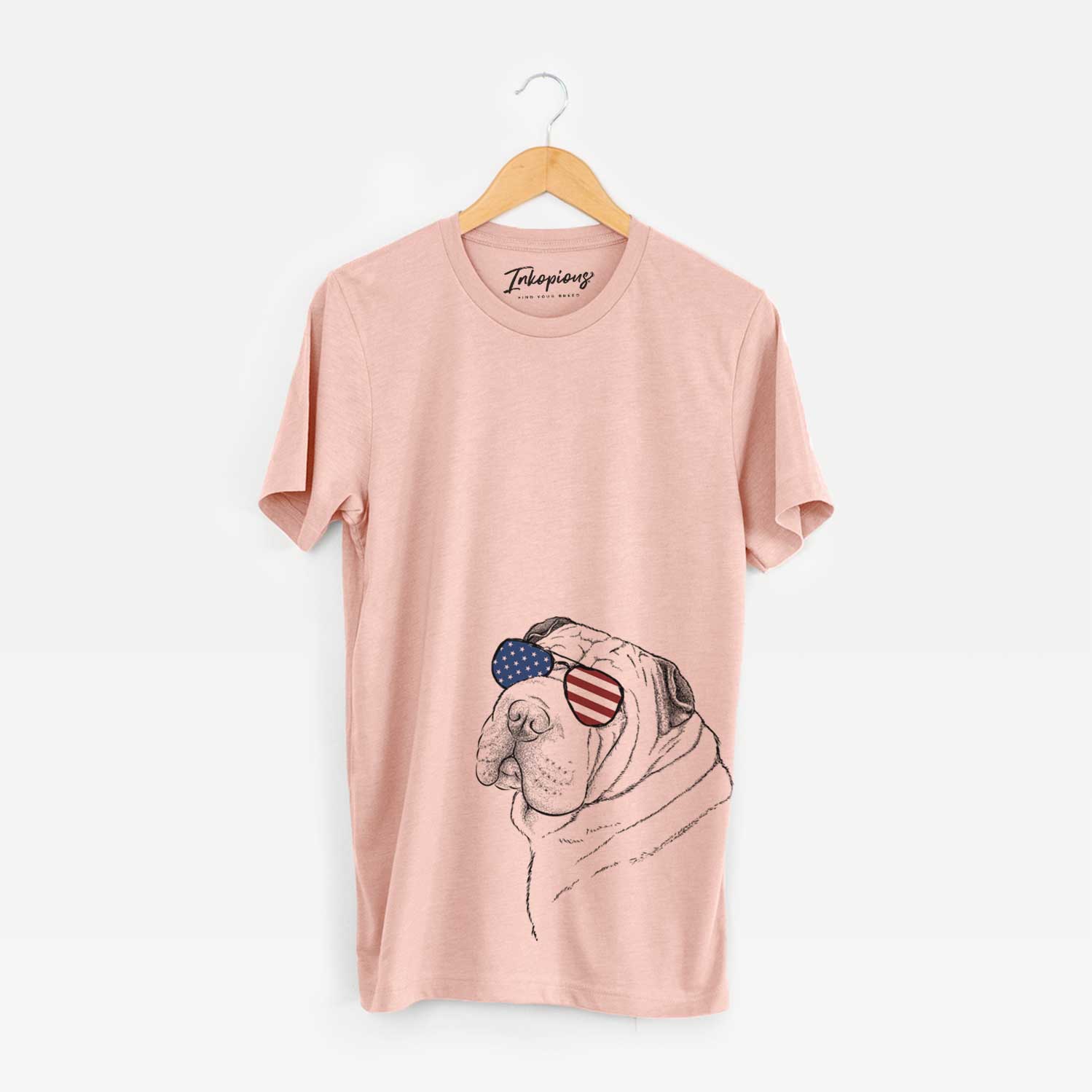 Hand-drawn sketch of Maximus the Shar Pei wearing American flag sunglasses on a Peach Unisex crewneck
