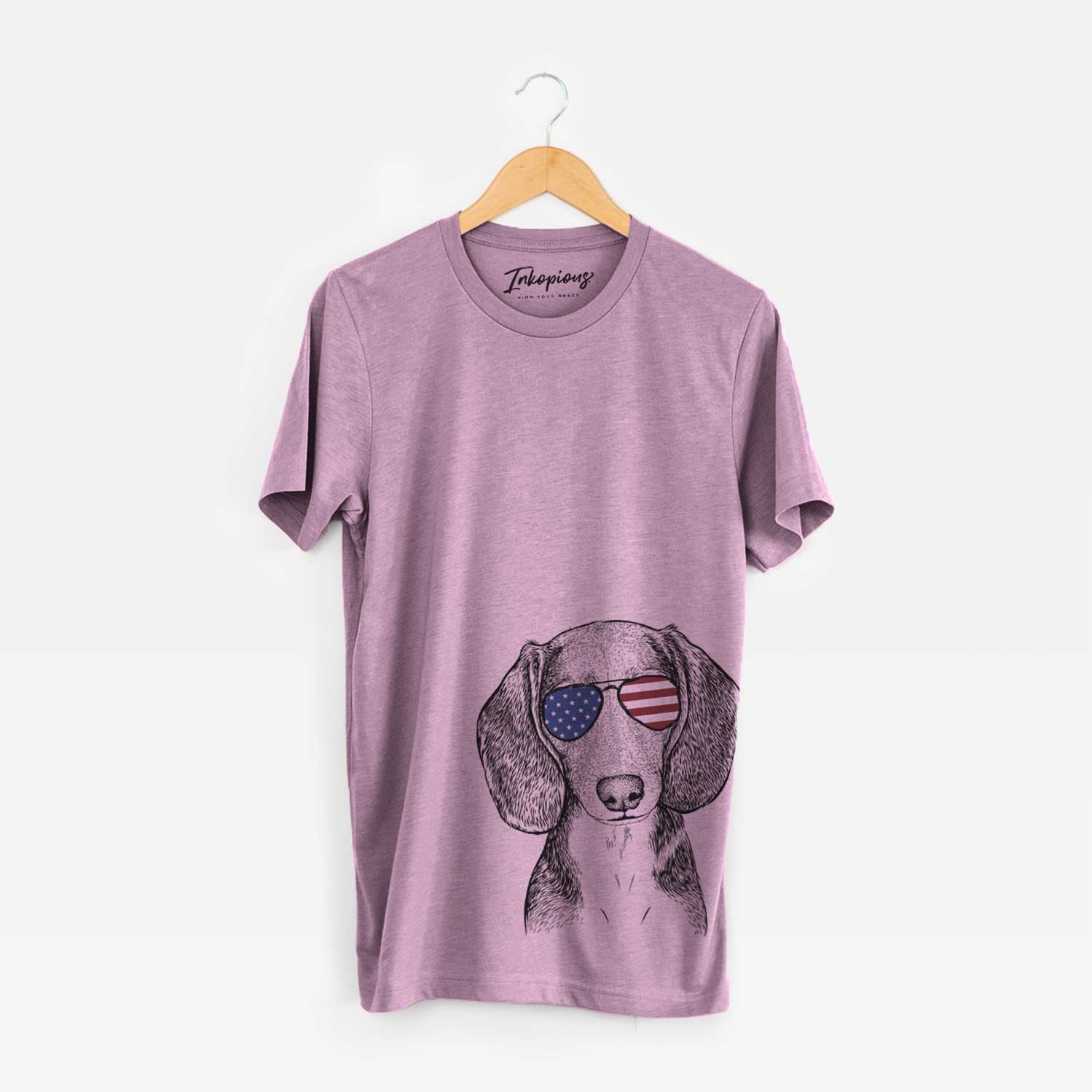 Hand-drawn sketch of Mayor Andy the Beagle wearing American flag sunglasses on an Orchid Unisex crewneck