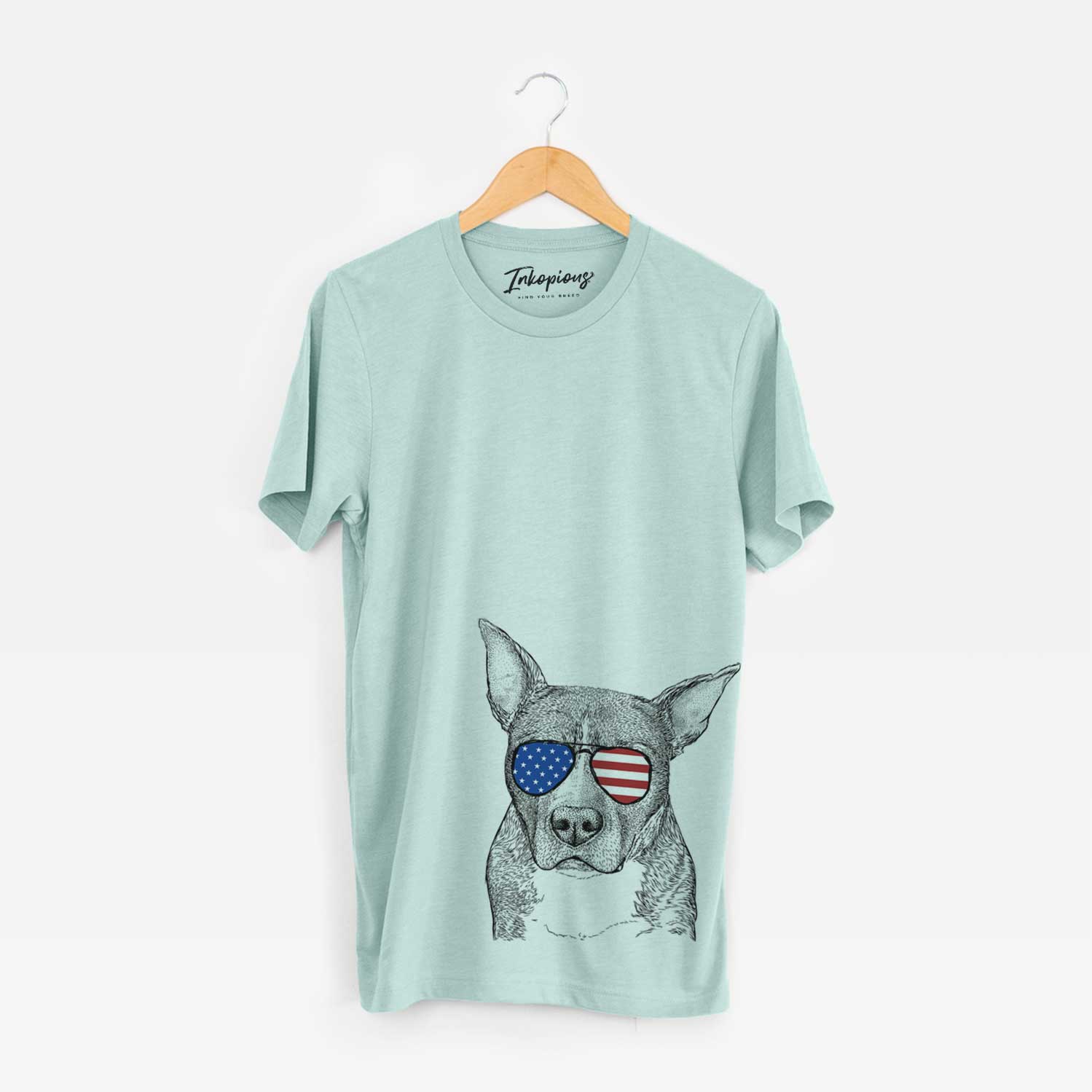 Hand-drawn sketch of Mercy the Pitbull wearing American flag sunglasses on a Heather Sage Unisex crewneck