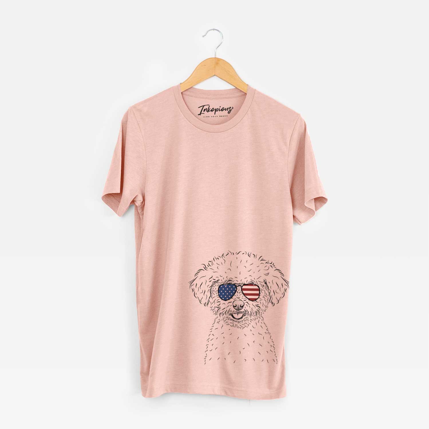 Hand-drawn sketch of Mickey the Bichon Frise wearing American flag sunglasses on a Peach Unisex crewneck