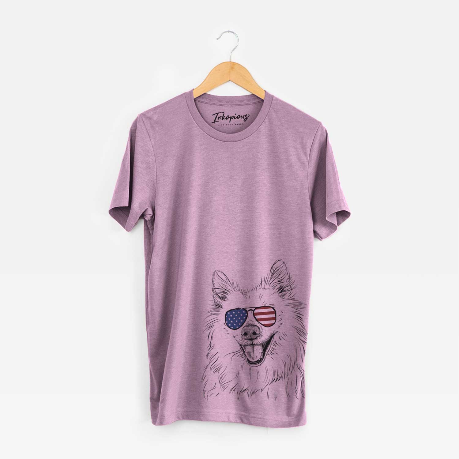 Hand-drawn sketch of Miki the American Eskimo wearing American flag sunglasses on an Orchid Unisex crewneck
