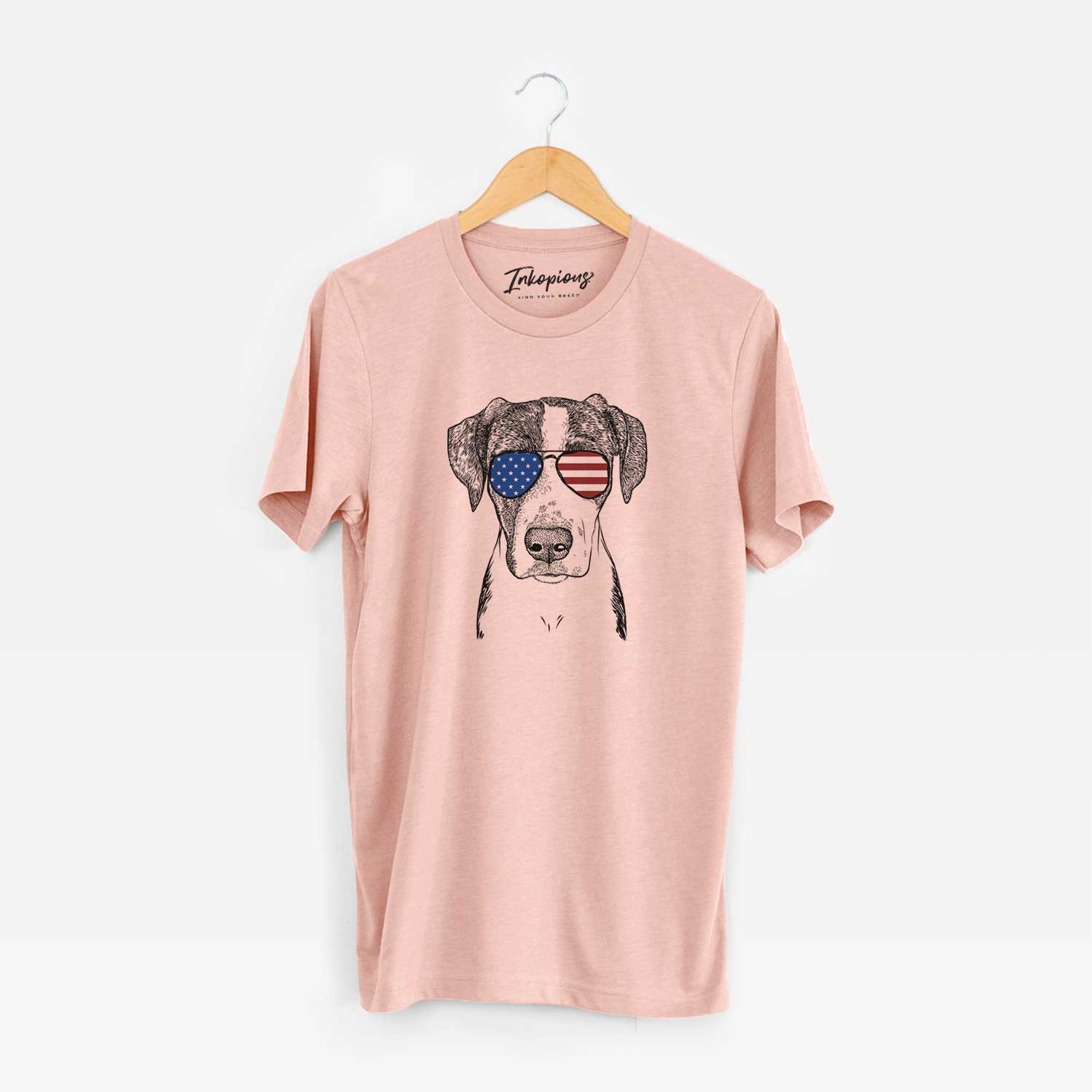 Hand-drawn sketch of Milo the Mixed Breed wearing American flag sunglasses on a Peach Unisex crewneck
