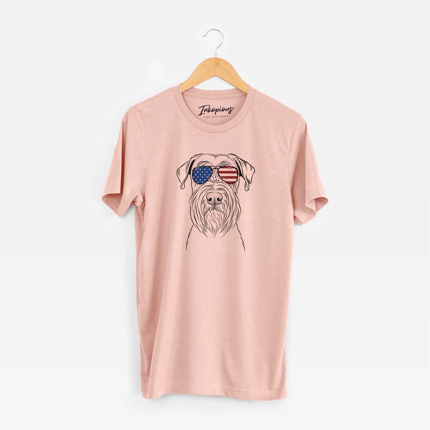Hand-drawn sketch of Milton the Schnauzer wearing American flag sunglasses on a Peach Unisex crewneck