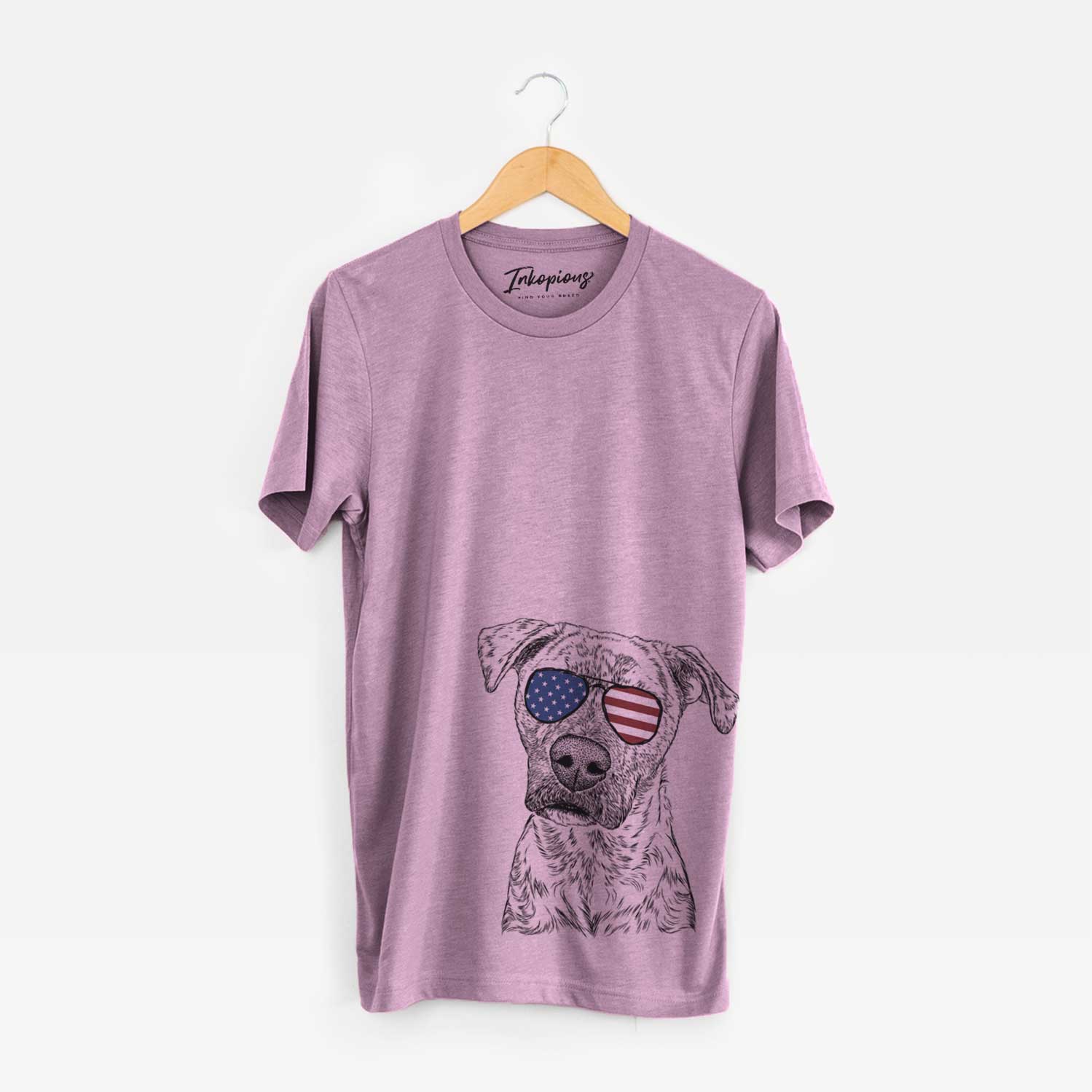 Hand-drawn sketch of Monster Baby the Pitbull Mix wearing American flag sunglasses on an Orchid Unisex crewneck