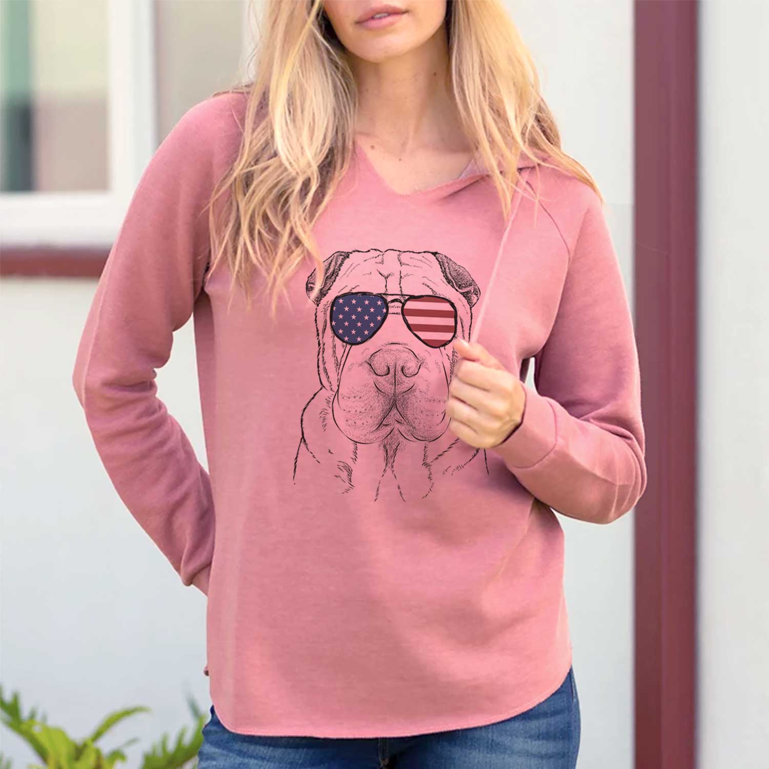 Hand-drawn sketch of Moomers the Shar Pei wearing American flag sunglasses on a Dusty Rose Cali Wave Hooded Sweatshirt, lifestyle photo