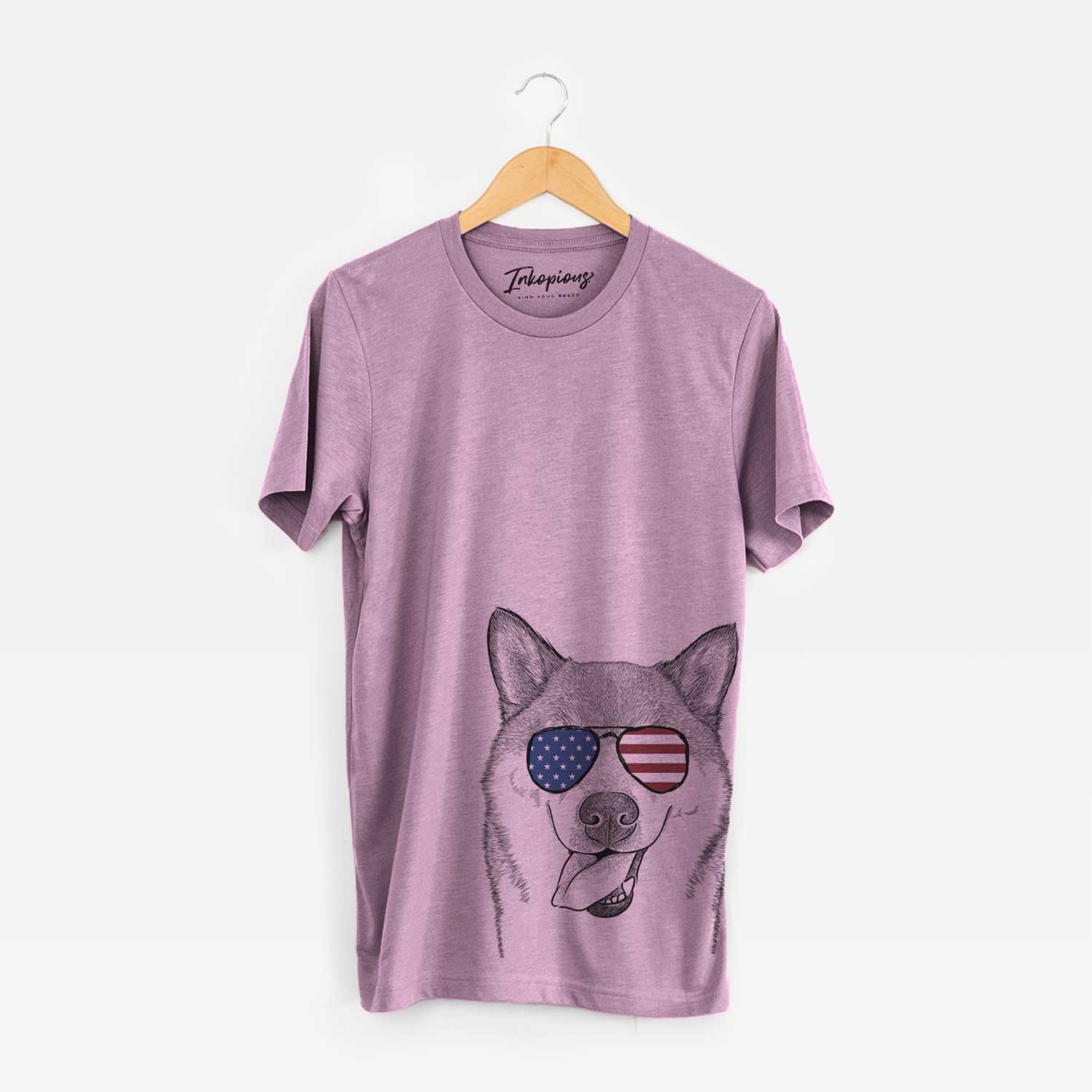 Hand-drawn sketch of Mothra the Shiba Inu wearing American flag sunglasses on an Orchid Unisex crewneck