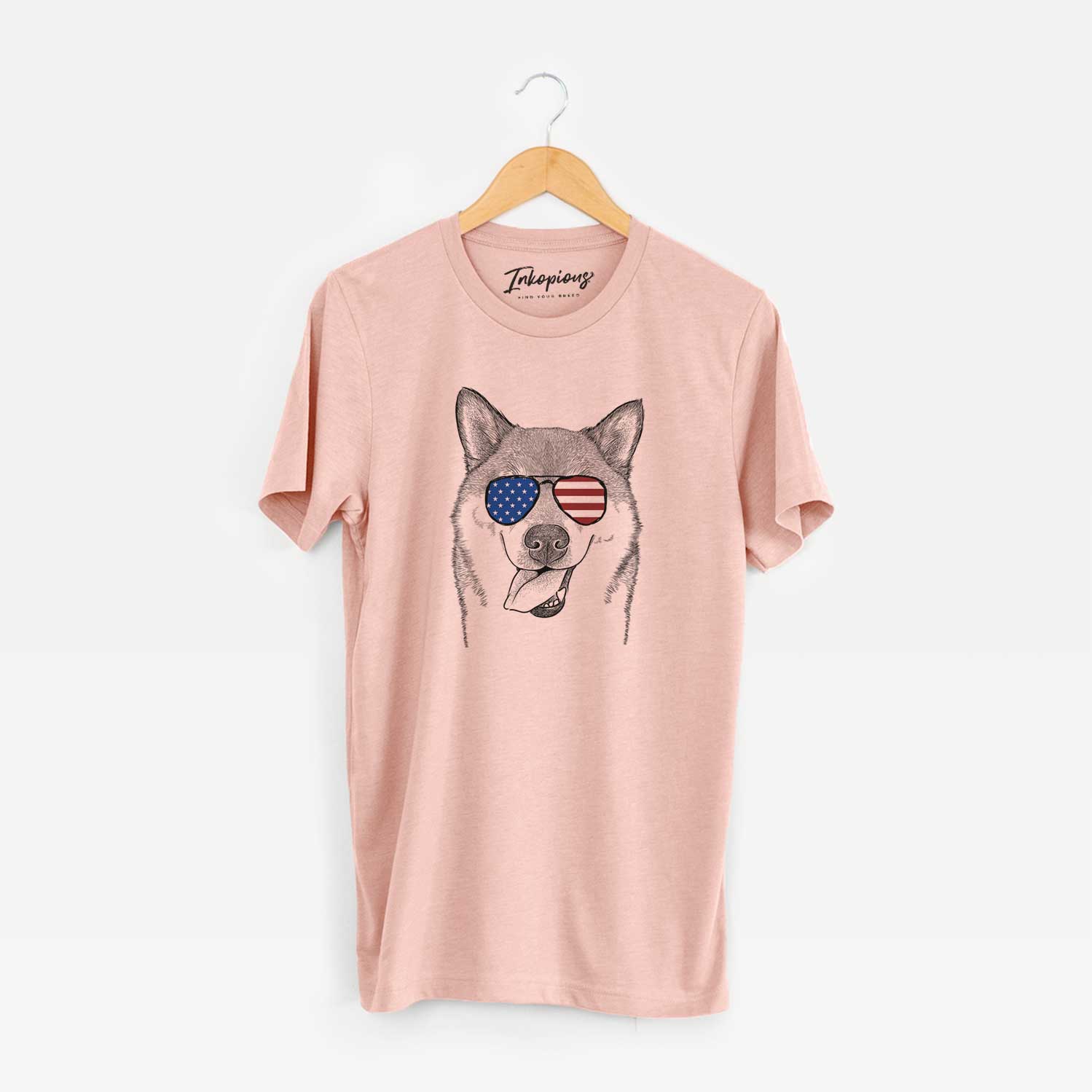 Hand-drawn sketch of Mothra the Shiba Inu wearing American flag sunglasses on a Peach Unisex crewneck