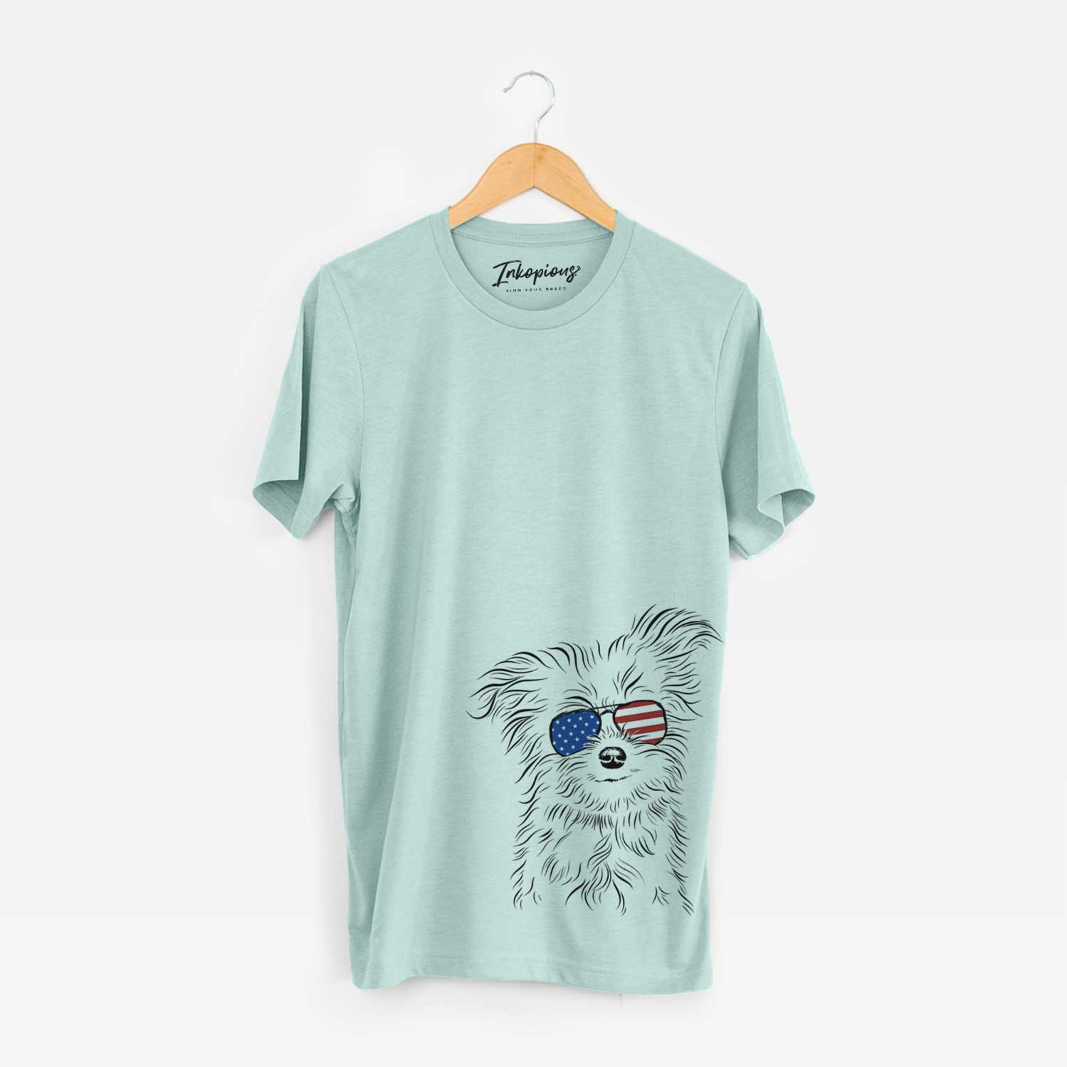 Hand-drawn sketch of Mr. Gucci Poochi the Maltese wearing American flag sunglasses on a Heather Sage Unisex crewneck