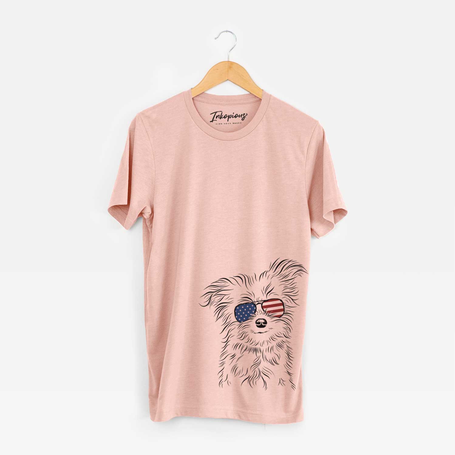 Hand-drawn sketch of Mr. Gucci Poochi the Maltese wearing American flag sunglasses on a Peach Unisex crewneck
