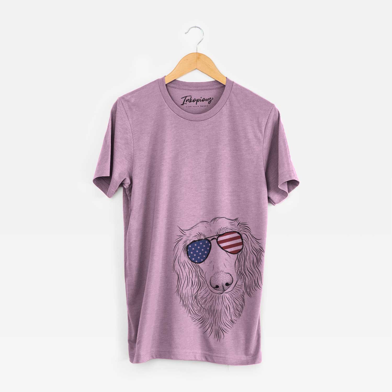 Hand-drawn sketch of Mr. Rusty the Long Haired Dachshund wearing American flag sunglasses on an Orchid Unisex crewneck