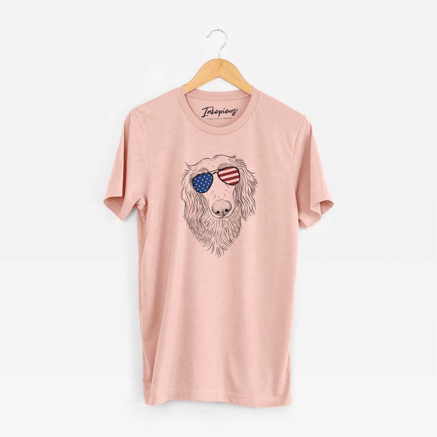 Hand-drawn sketch of Mr. Rusty the Long Haired Dachshund wearing American flag sunglasses on a Peach Unisex crewneck