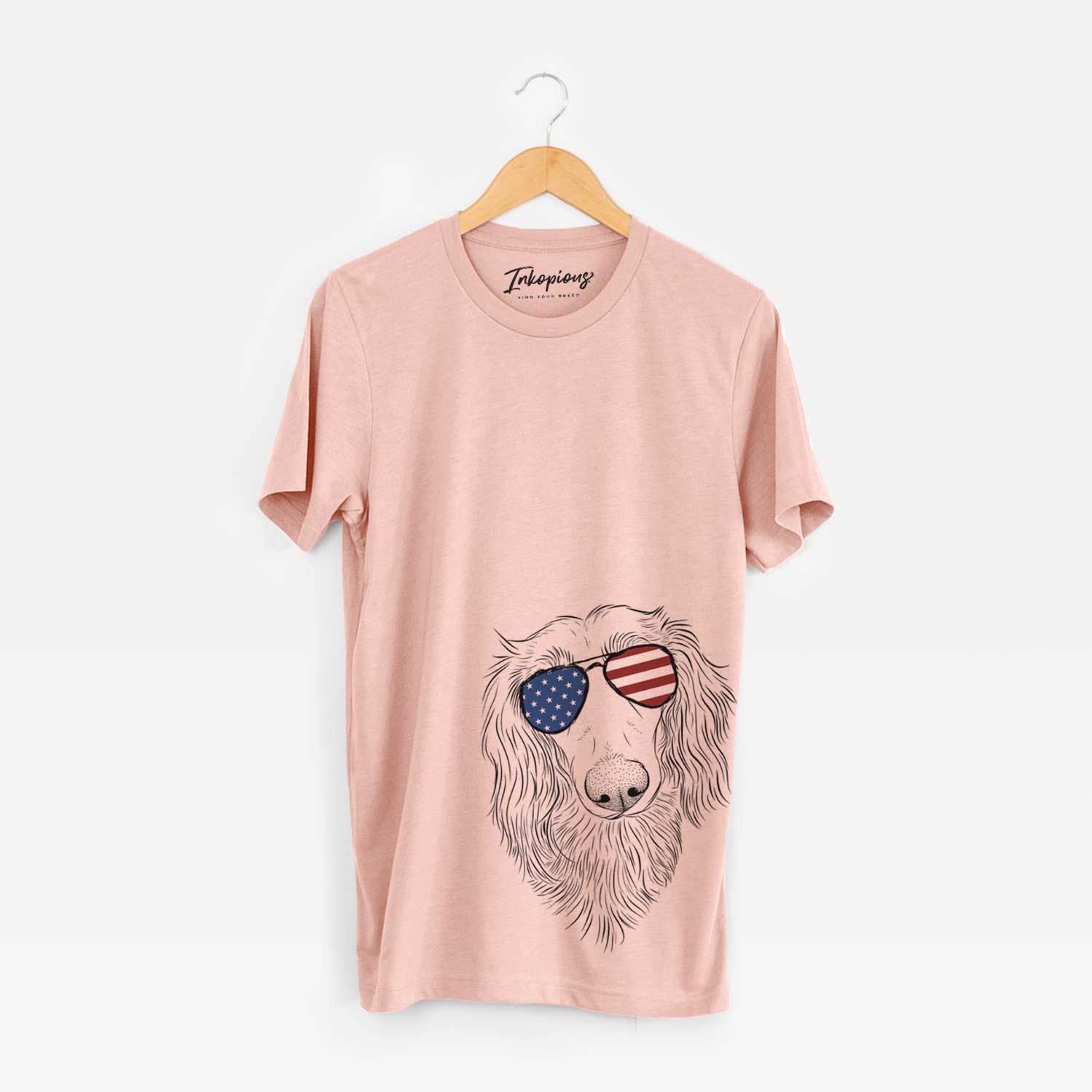 Hand-drawn sketch of Mr. Rusty the Long Haired Dachshund wearing American flag sunglasses on a Peach Unisex crewneck