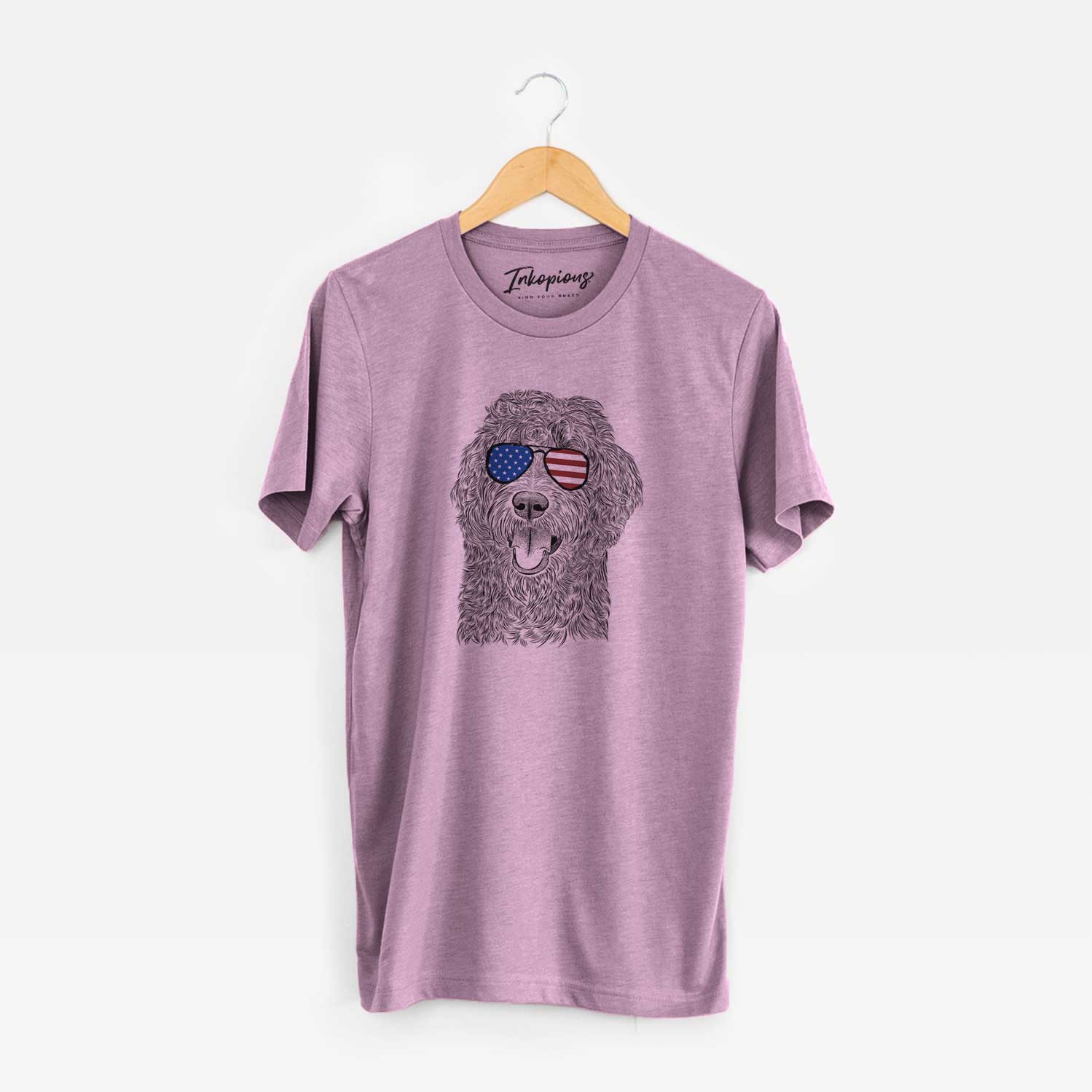 Hand-drawn sketch of Murr Dog the Labradoodle wearing American flag sunglasses on an Orchid Unisex crewneck