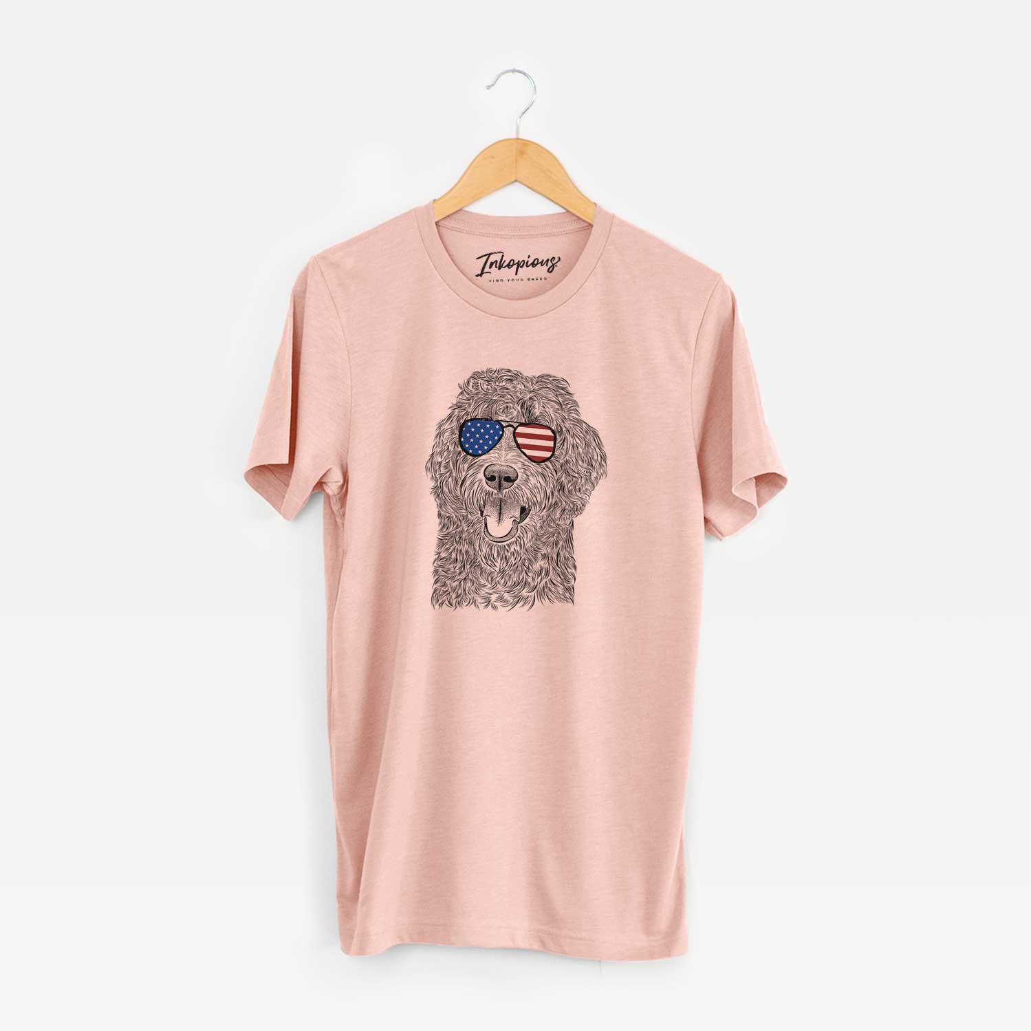 Hand-drawn sketch of Murr Dog the Labradoodle wearing American flag sunglasses on a Peach Unisex crewneck