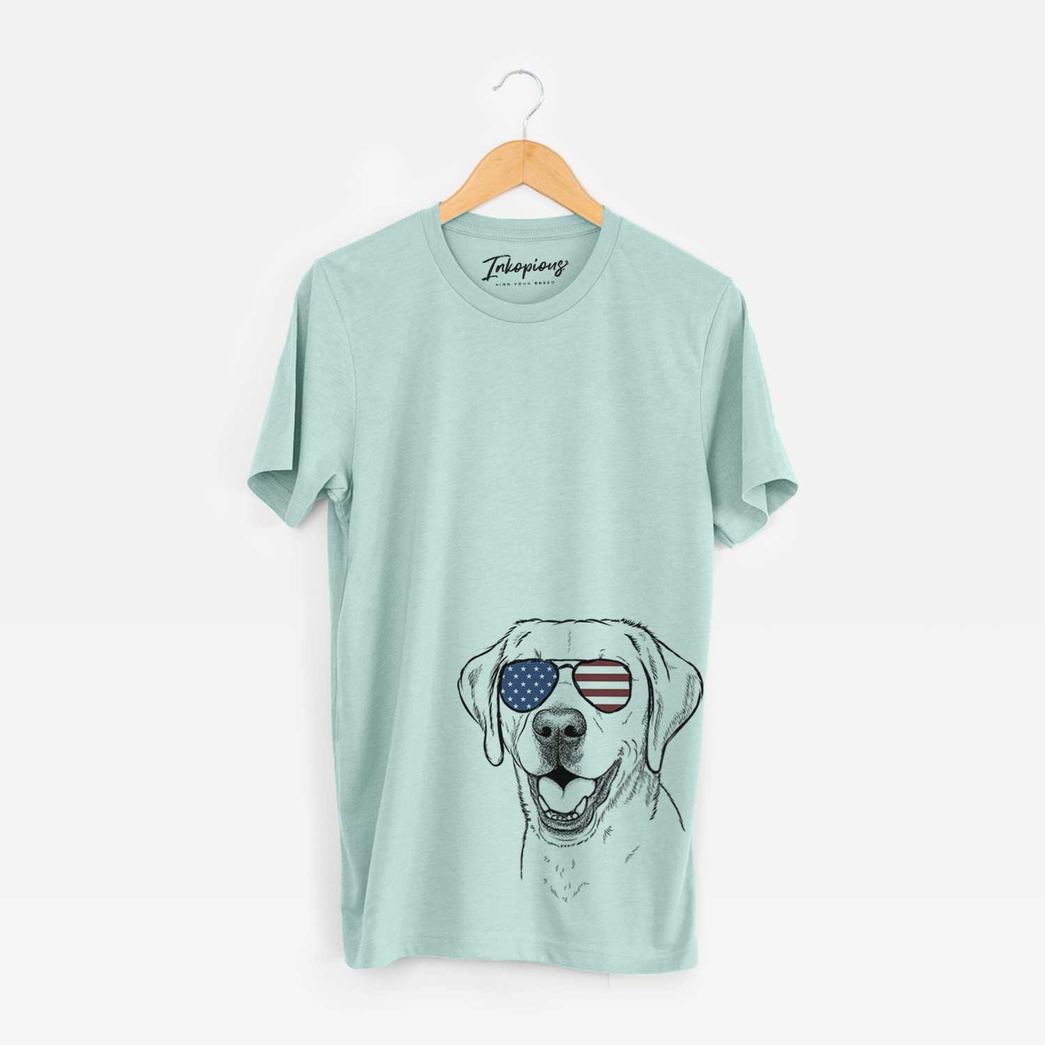 Hand-drawn sketch of Nate the Labrador Retriever wearing American flag sunglasses on a Heather Sage Unisex crewneck