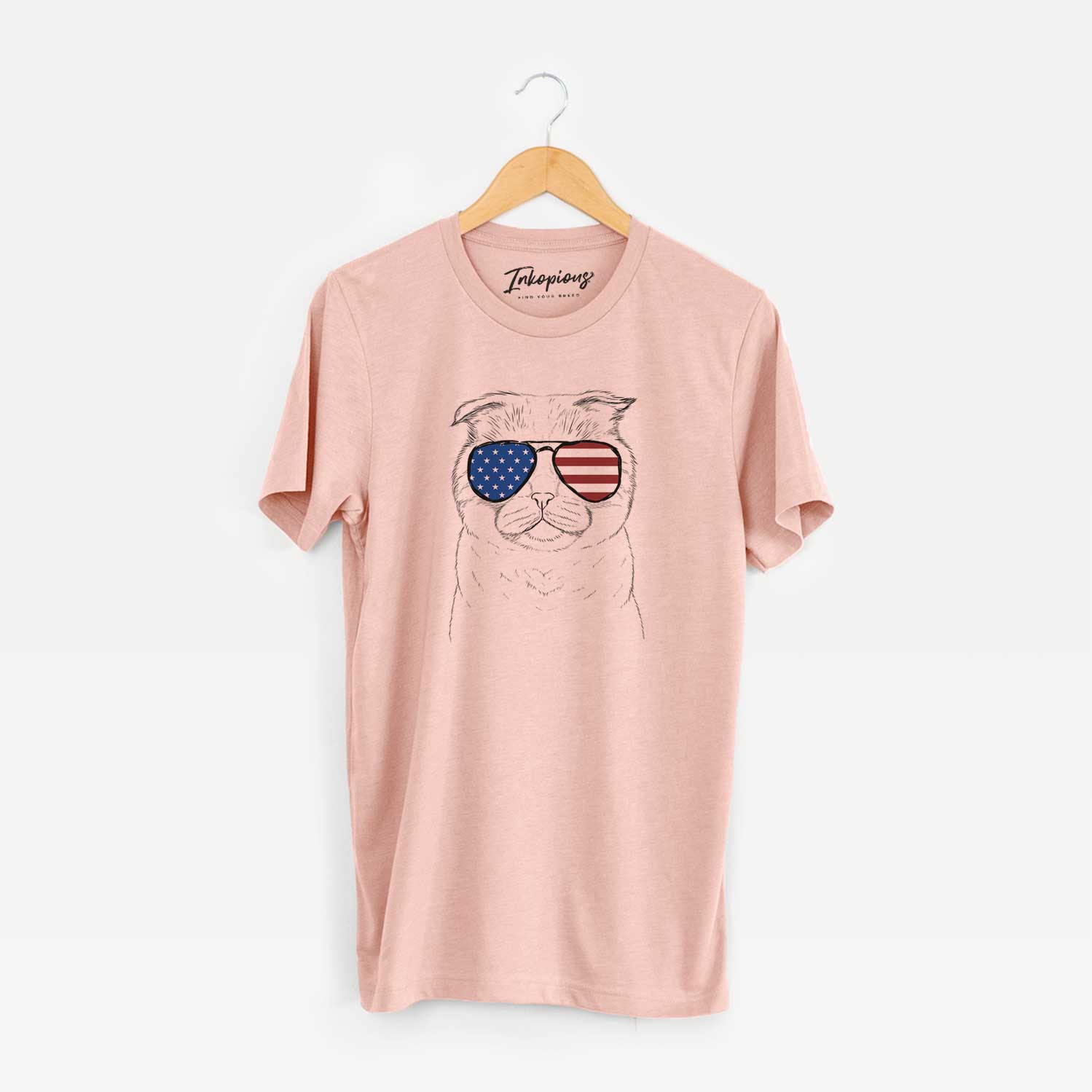 Hand-drawn sketch of Neko the Scottish Fold Cat wearing American flag sunglasses on a Peach Unisex crewneck