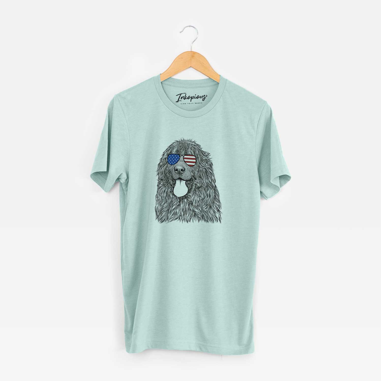 Hand-drawn sketch of Neptune the Newfoundland wearing American flag sunglasses on a Heather Sage Unisex crewneck