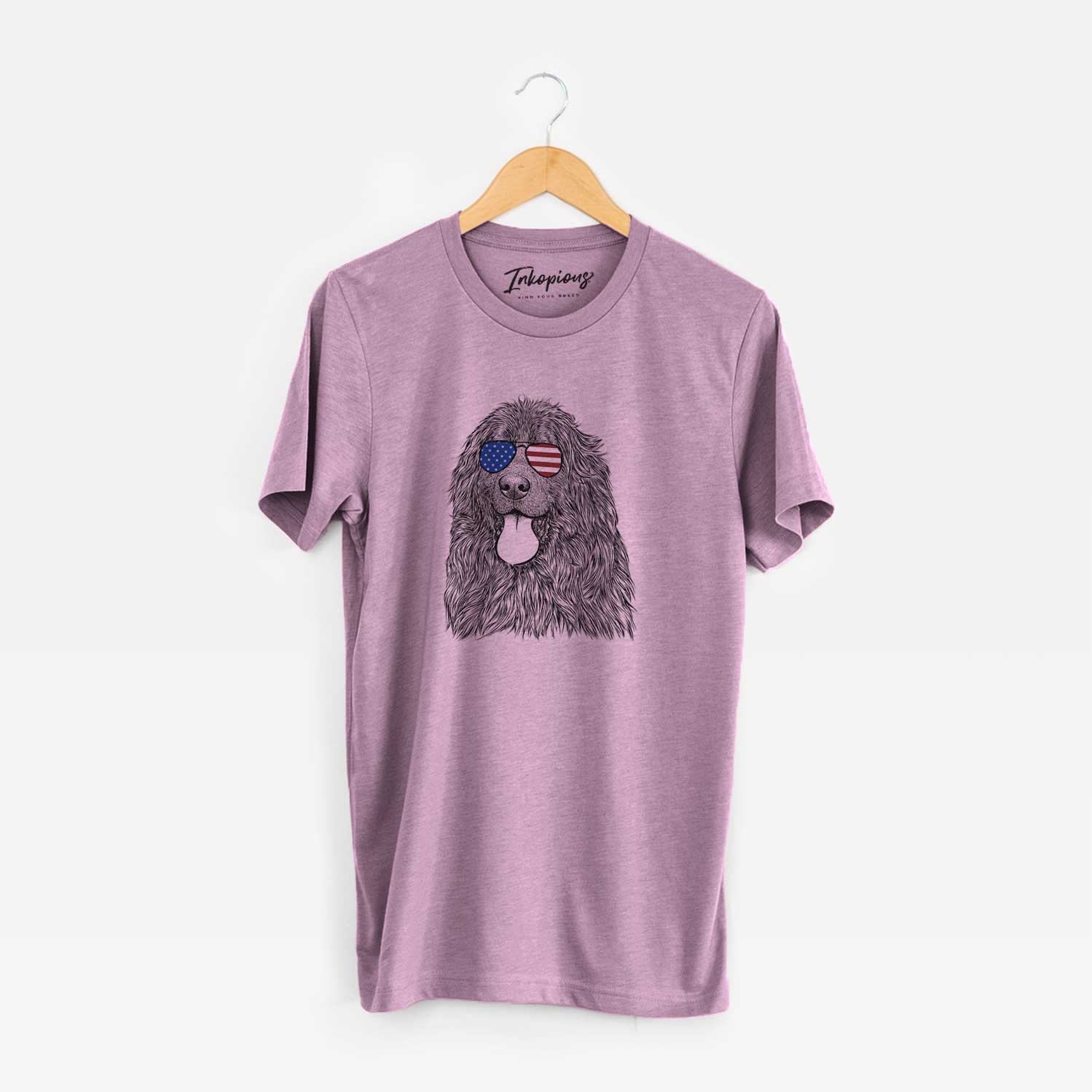 Hand-drawn sketch of Neptune the Newfoundland wearing American flag sunglasses on an Orchid Unisex crewneck