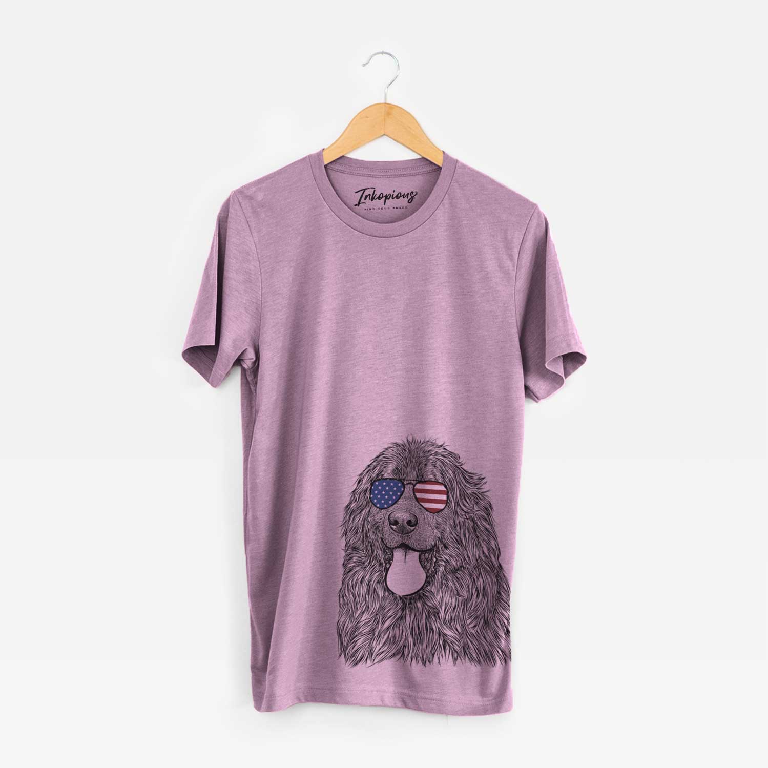 Hand-drawn sketch of Neptune the Newfoundland wearing American flag sunglasses on an Orchid Unisex crewneck