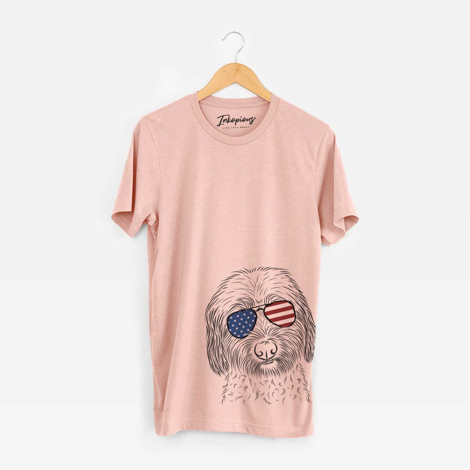 Hand-drawn sketch of Niles the Soft Coated Wheaten Terrier wearing American flag sunglasses on a Peach Unisex crewneck