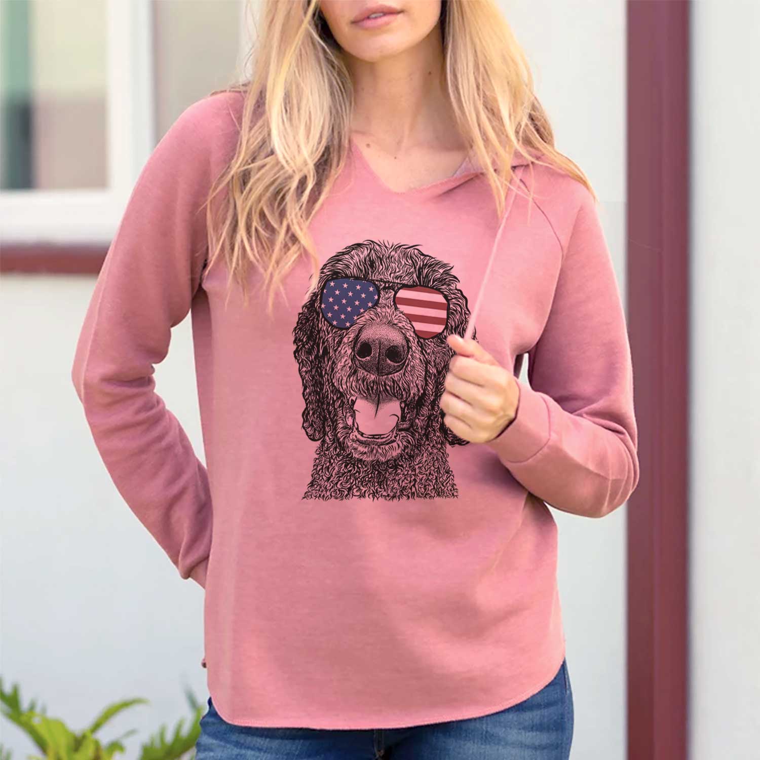 Hand-drawn sketch of Obi James the Goldendoodle wearing American flag sunglasses on a Dusty Rose Cali Wave Hooded Sweatshirt, lifestyle photo