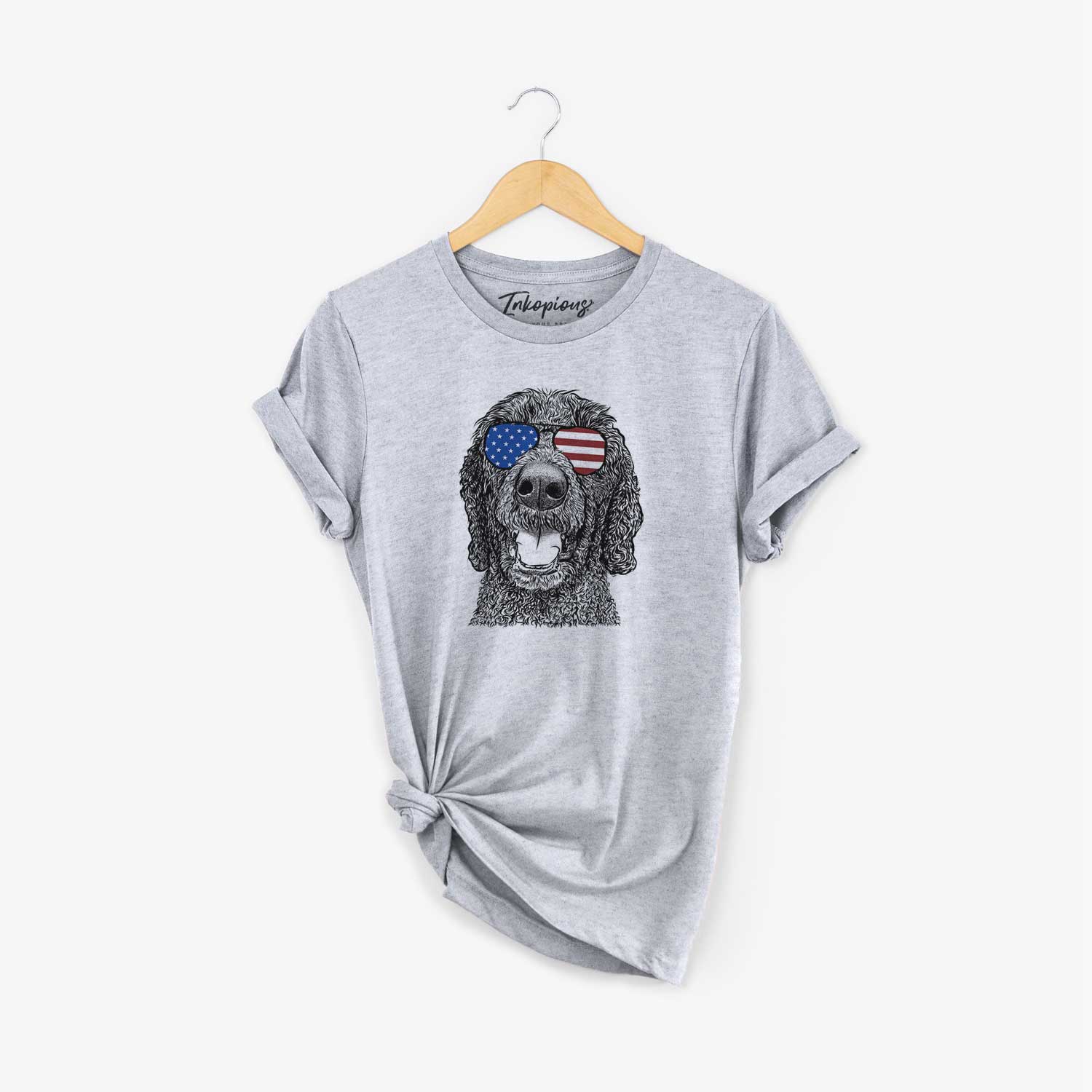 Hand-drawn sketch of Obi James the Goldendoodle wearing American flag sunglasses on a Grey Unisex crewneck